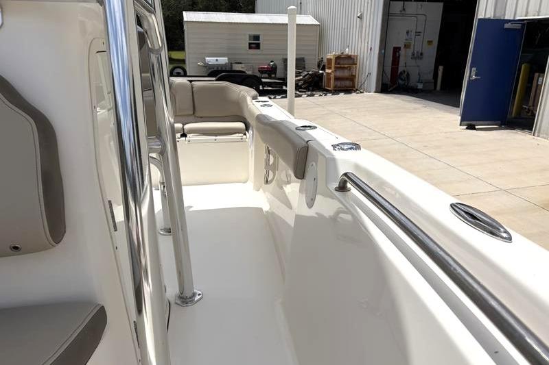 2023 Key West 203 FS boat interior with seating and stainless steel railings.