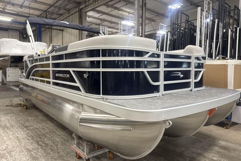 2026 Bennington 22 SSRSF pontoon boat in a warehouse setting.