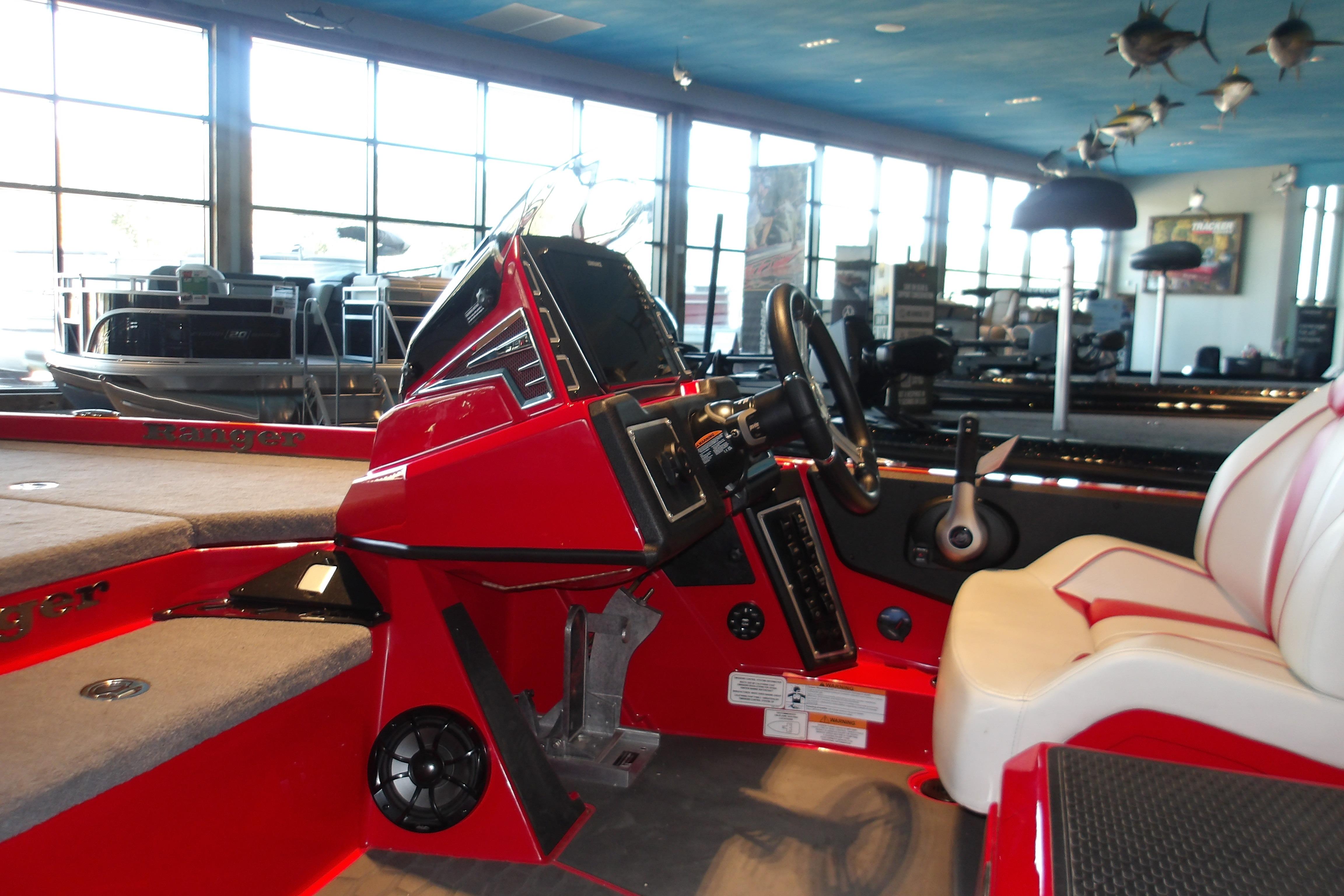2025 Ranger Z519R Cup-Equipped boat interior with red console and seating.