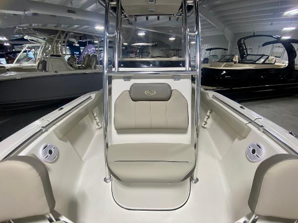 2024 Key West 219 FS boat interior with beige seating and stainless steel frame.