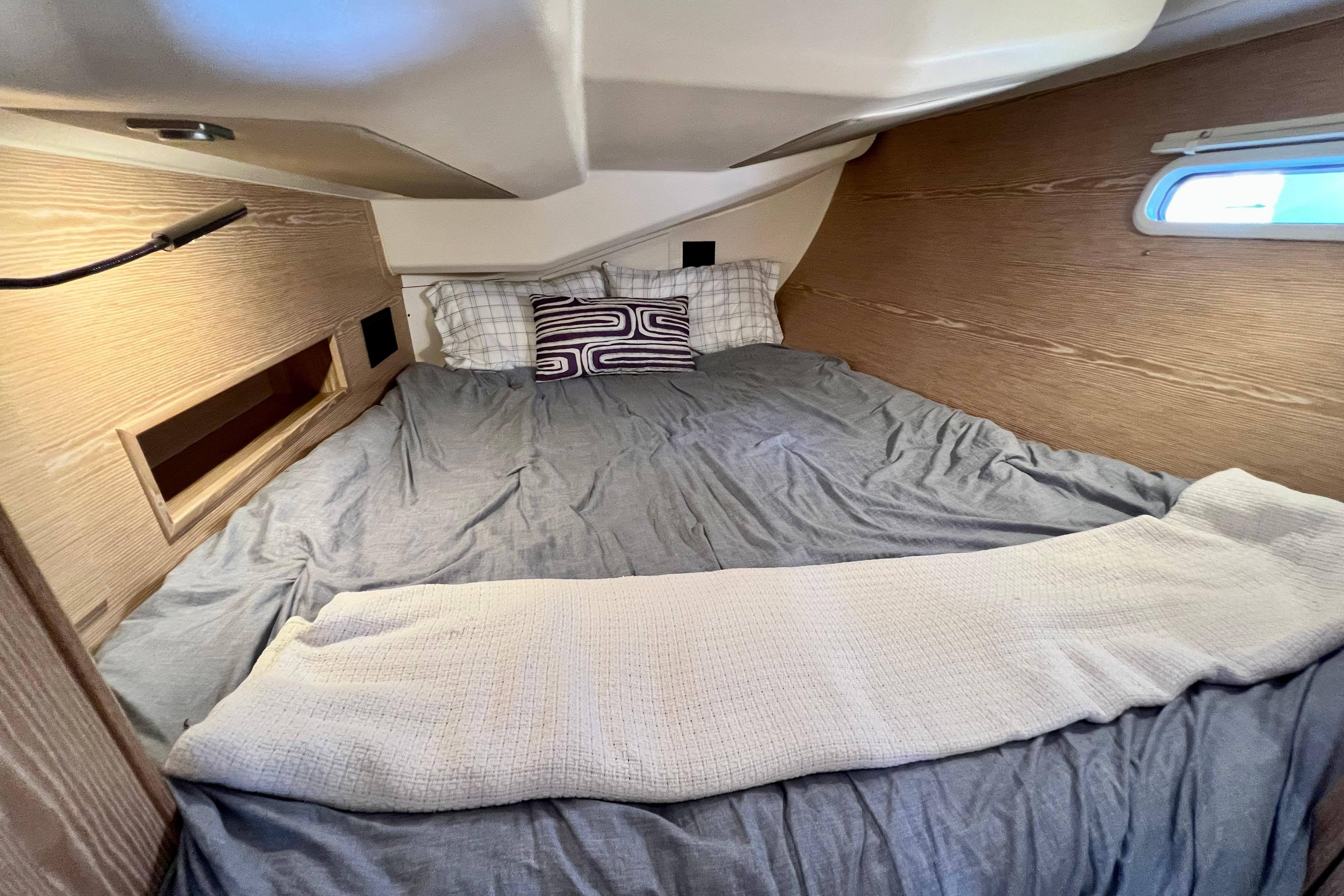 Cozy cabin interior of 2016 Hanse 455 yacht with comfortable bedding.