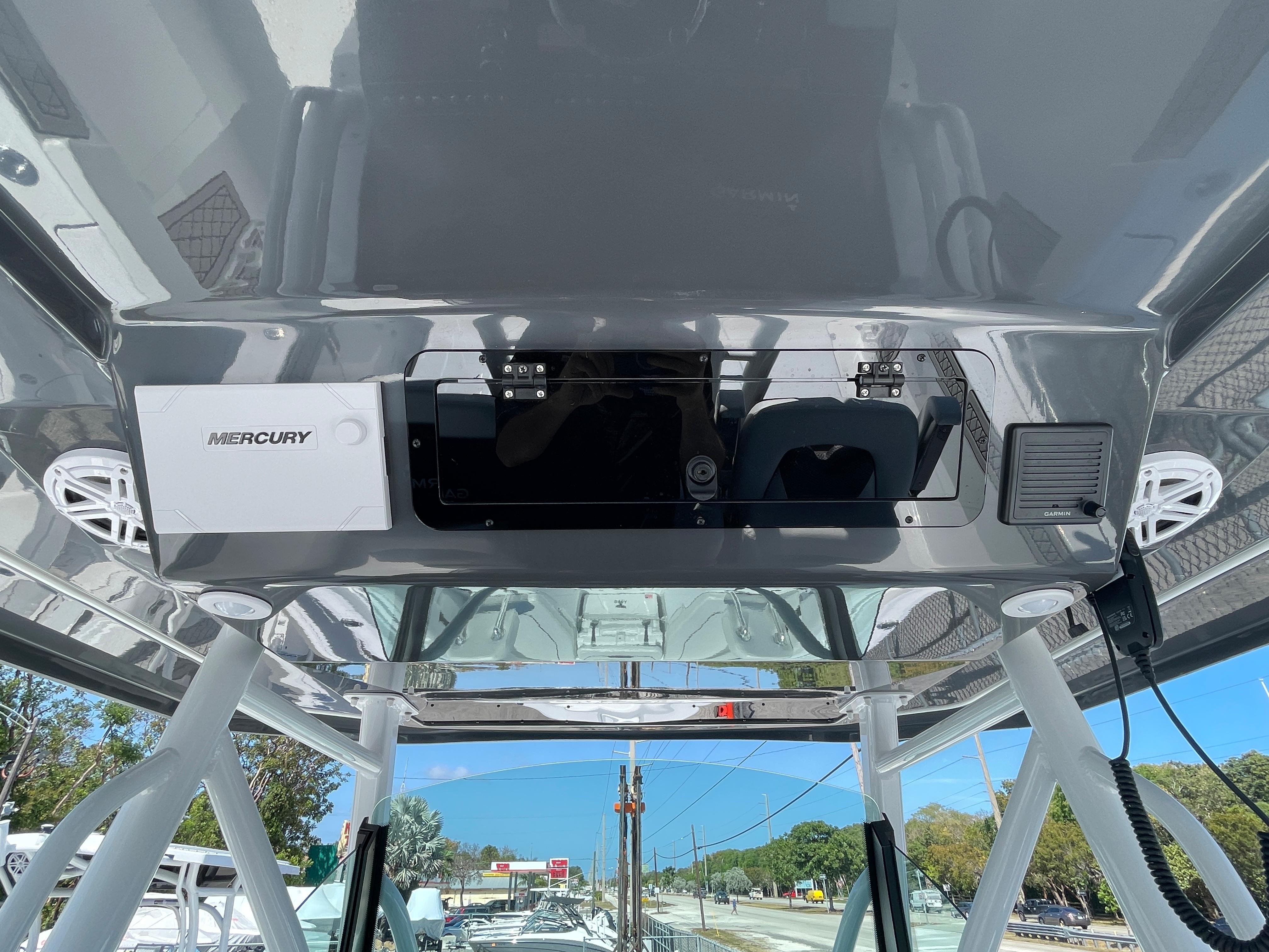 2023 Wellcraft 352 Fisherman boat console with Mercury electronics and overhead view.