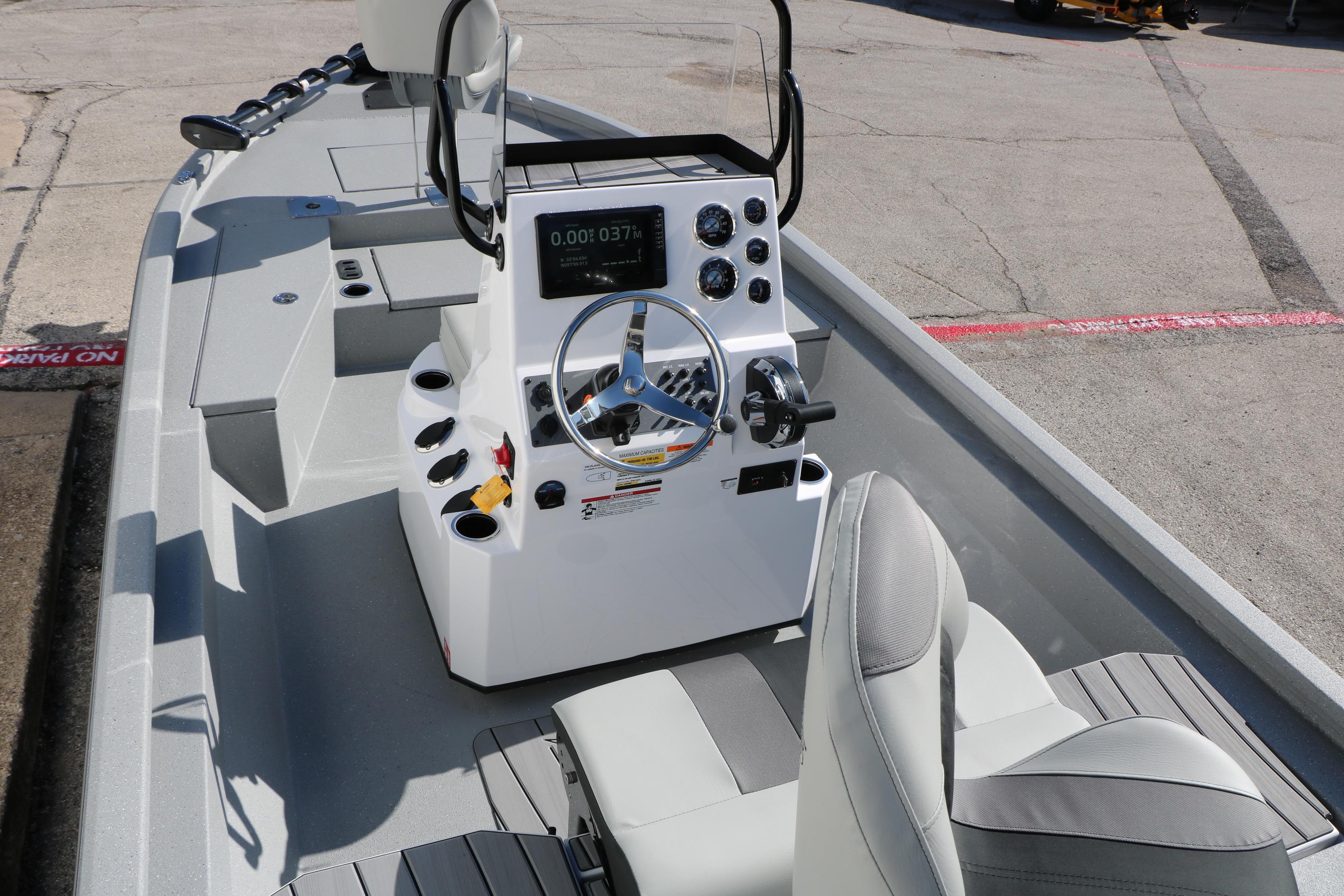 2026 Vexus ACX2000 boat interior with modern steering console and seating.