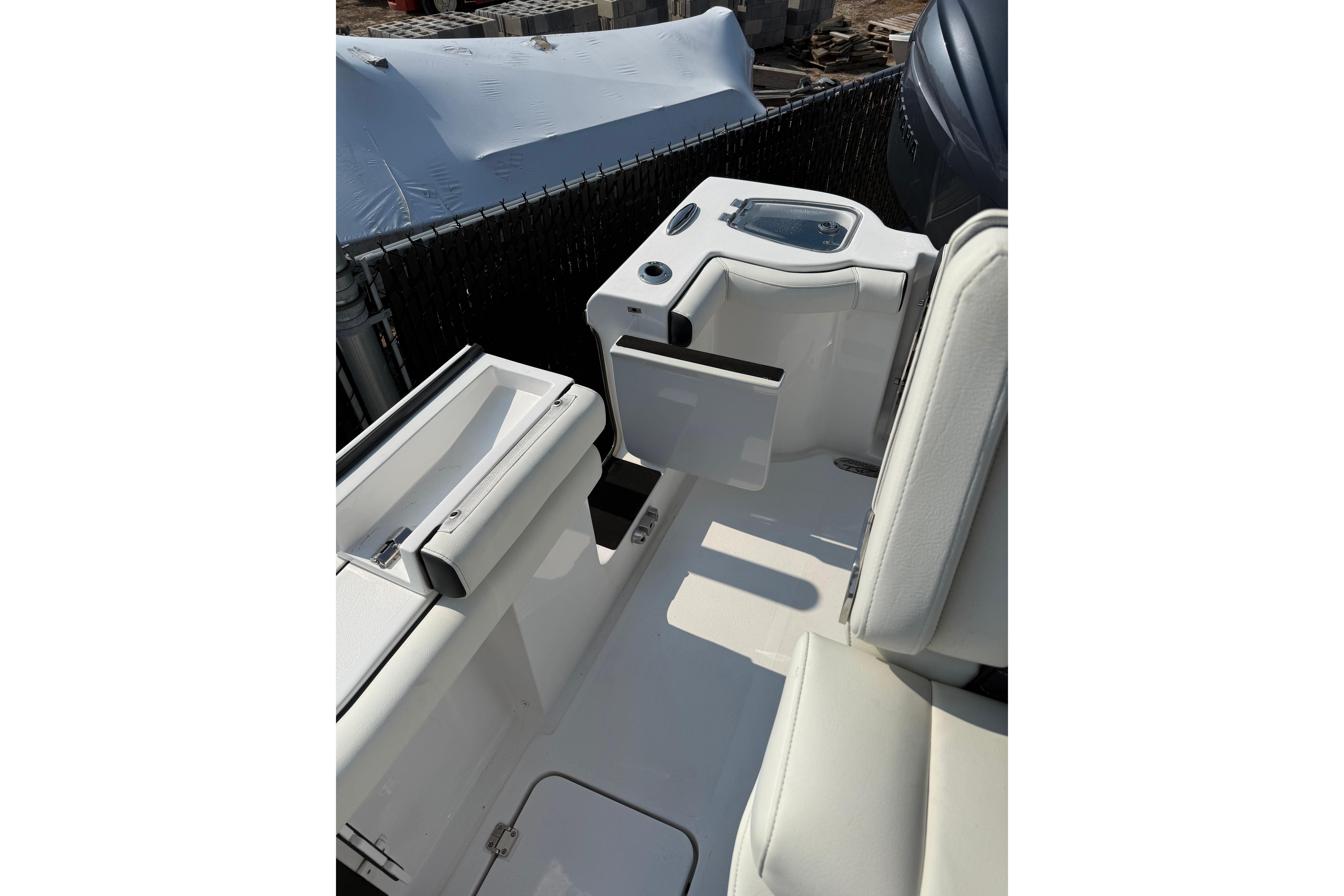 2026 Tidewater 256 CC Adventure boat interior with seating and storage compartments.