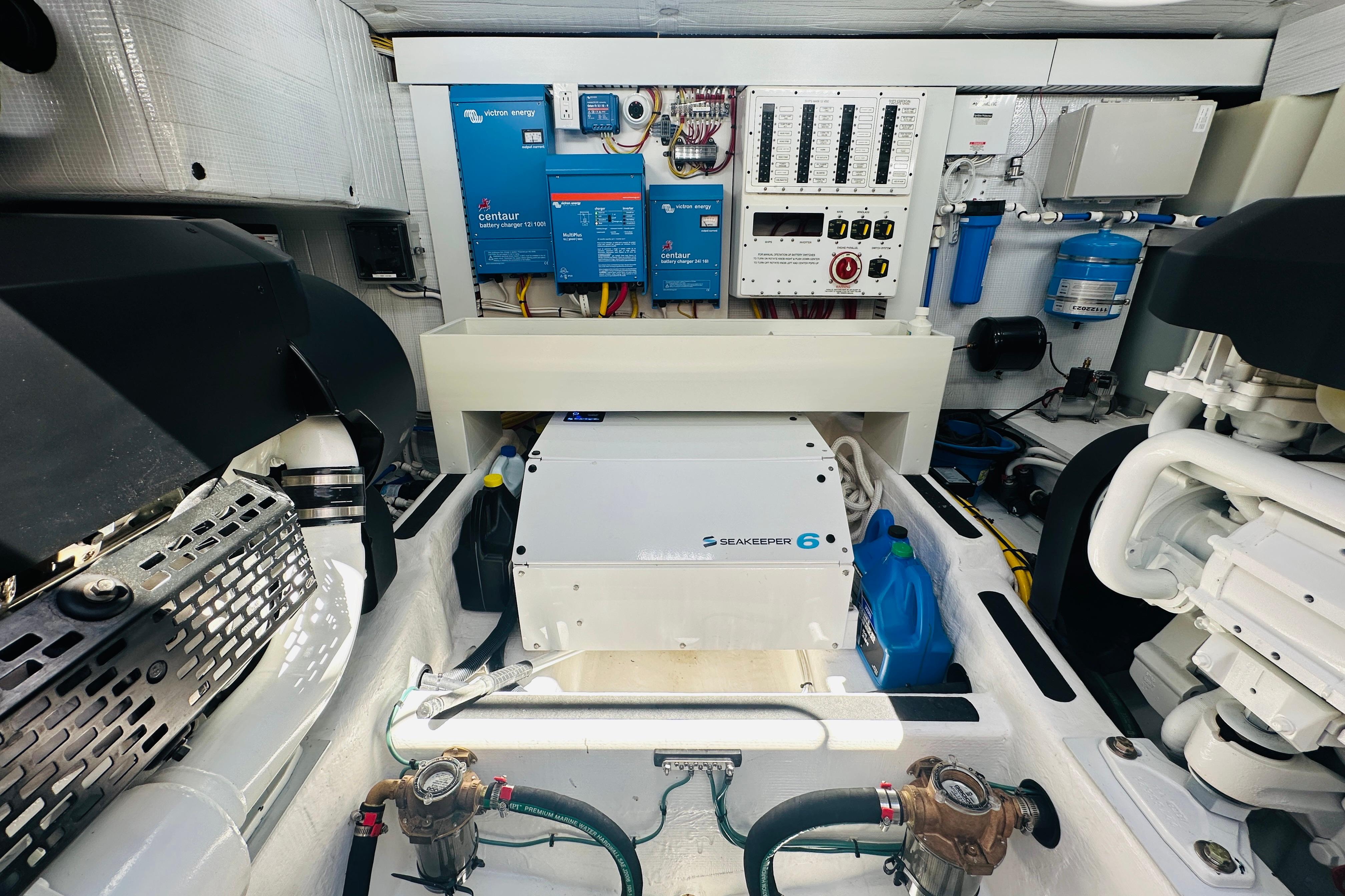 Engine room of 2025 Sabre 48 Salon Express with Seakeeper 6 and electrical systems.
