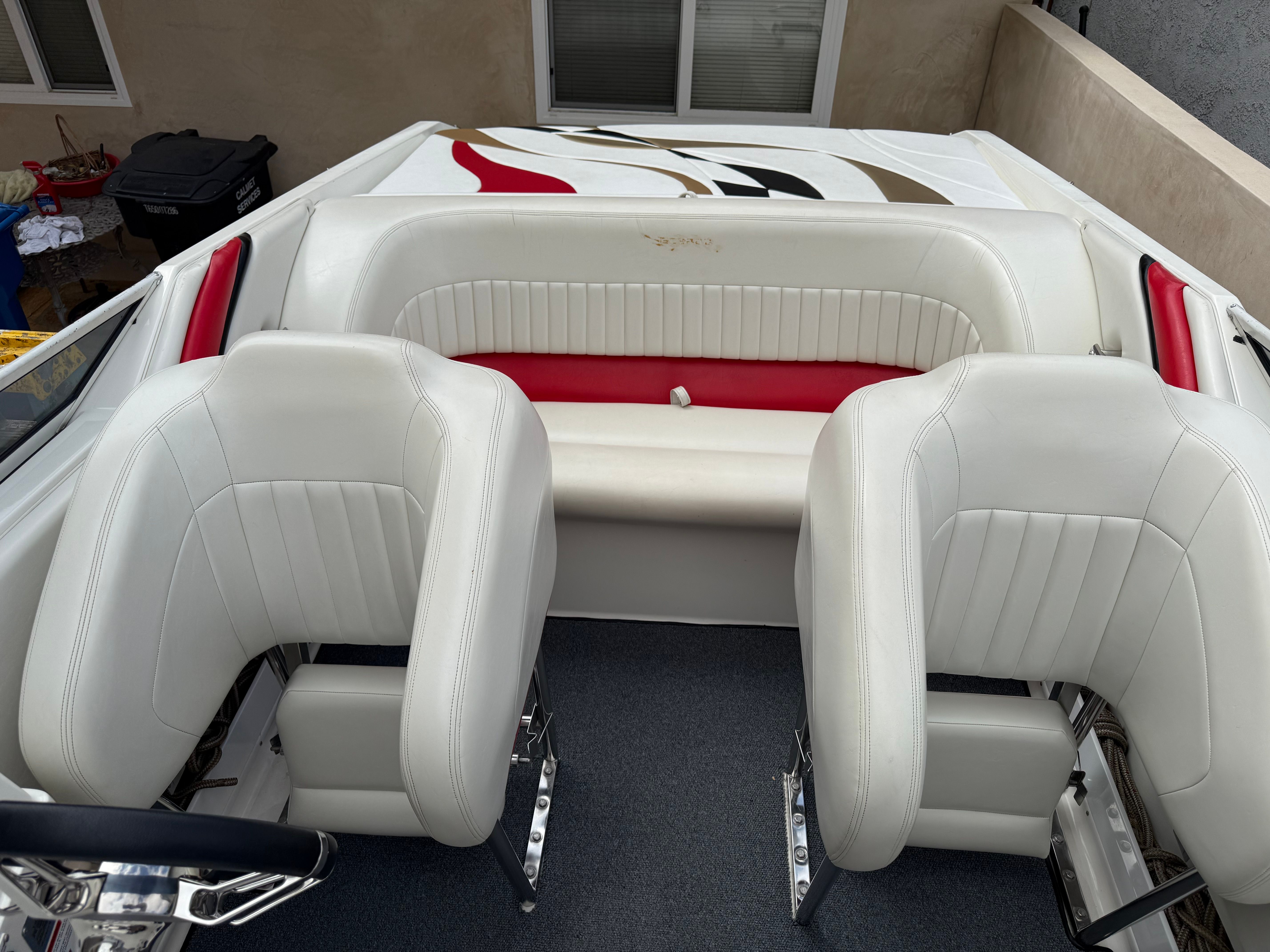 Interior of a 2001 Wellcraft 29 Scarab boat with white seating.