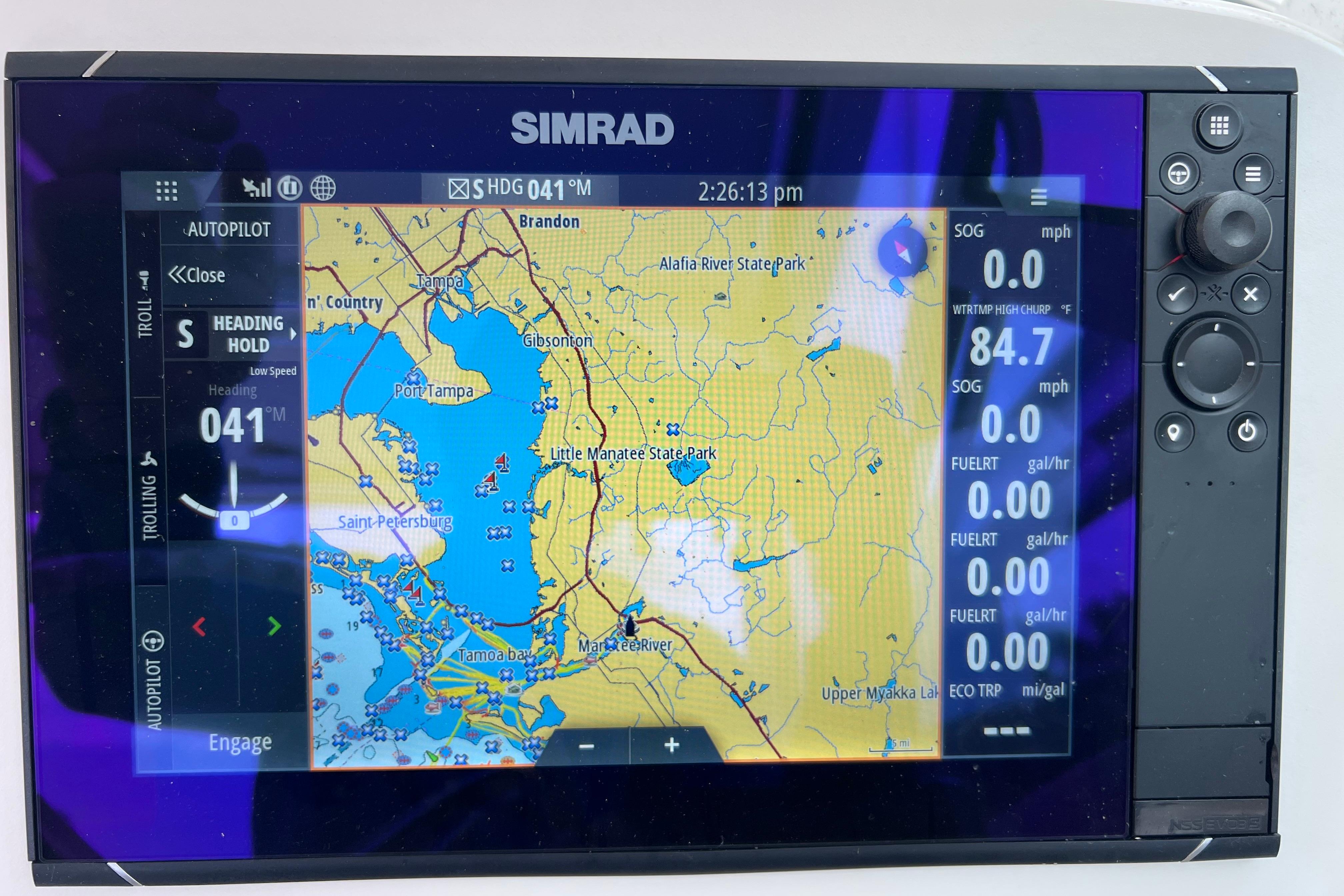 Simrad navigation display on a 2005 Pursuit 3070 Offshore boat, showing Tampa Bay map.