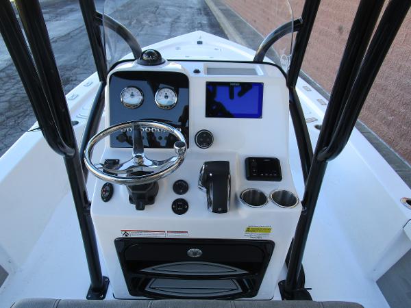 2025 Sea Pro 230 Bay boat console with steering wheel and navigation display.