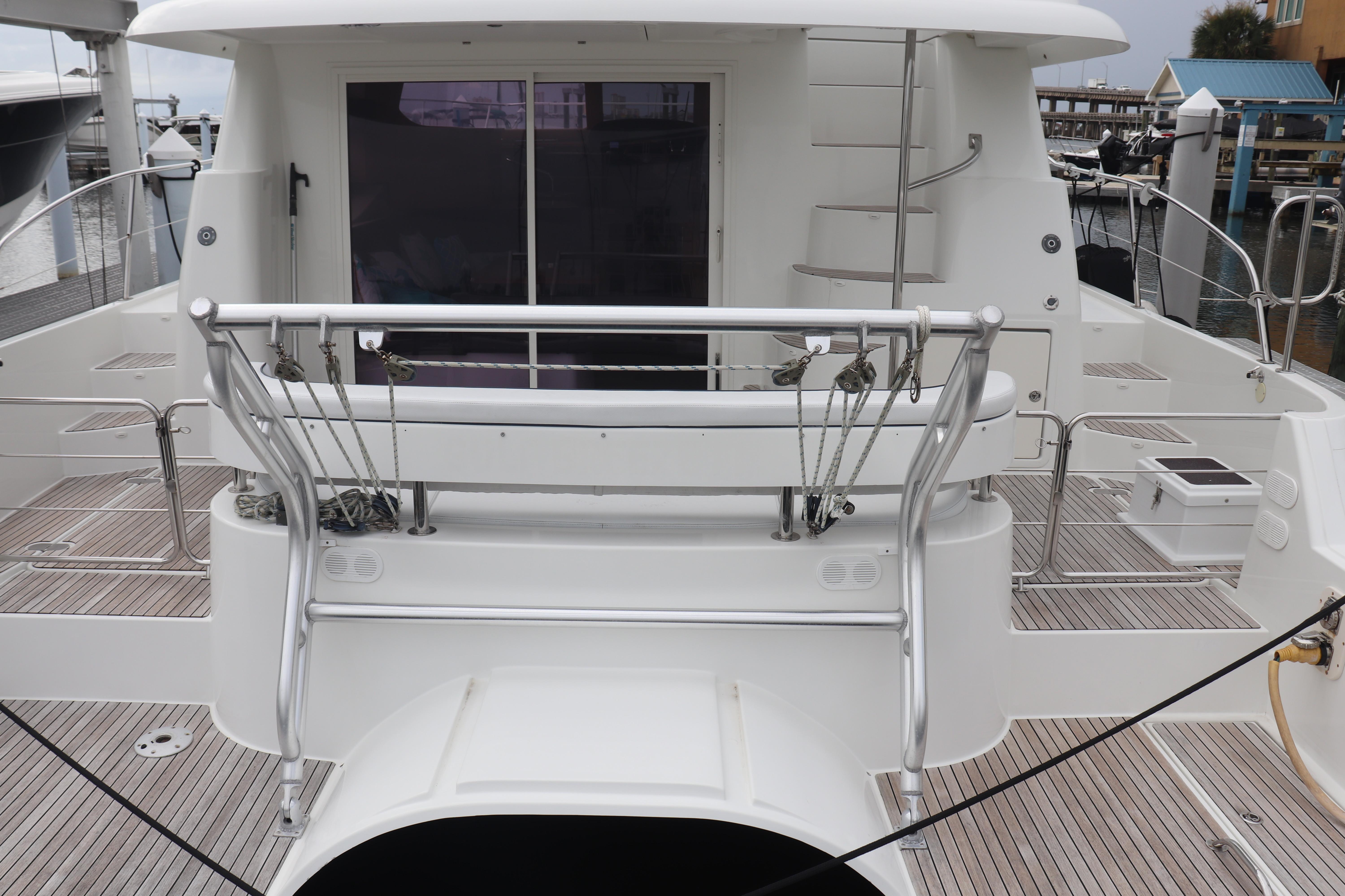 Rear view of 2012 Fountaine Pajot 40 catamaran docked at marina.