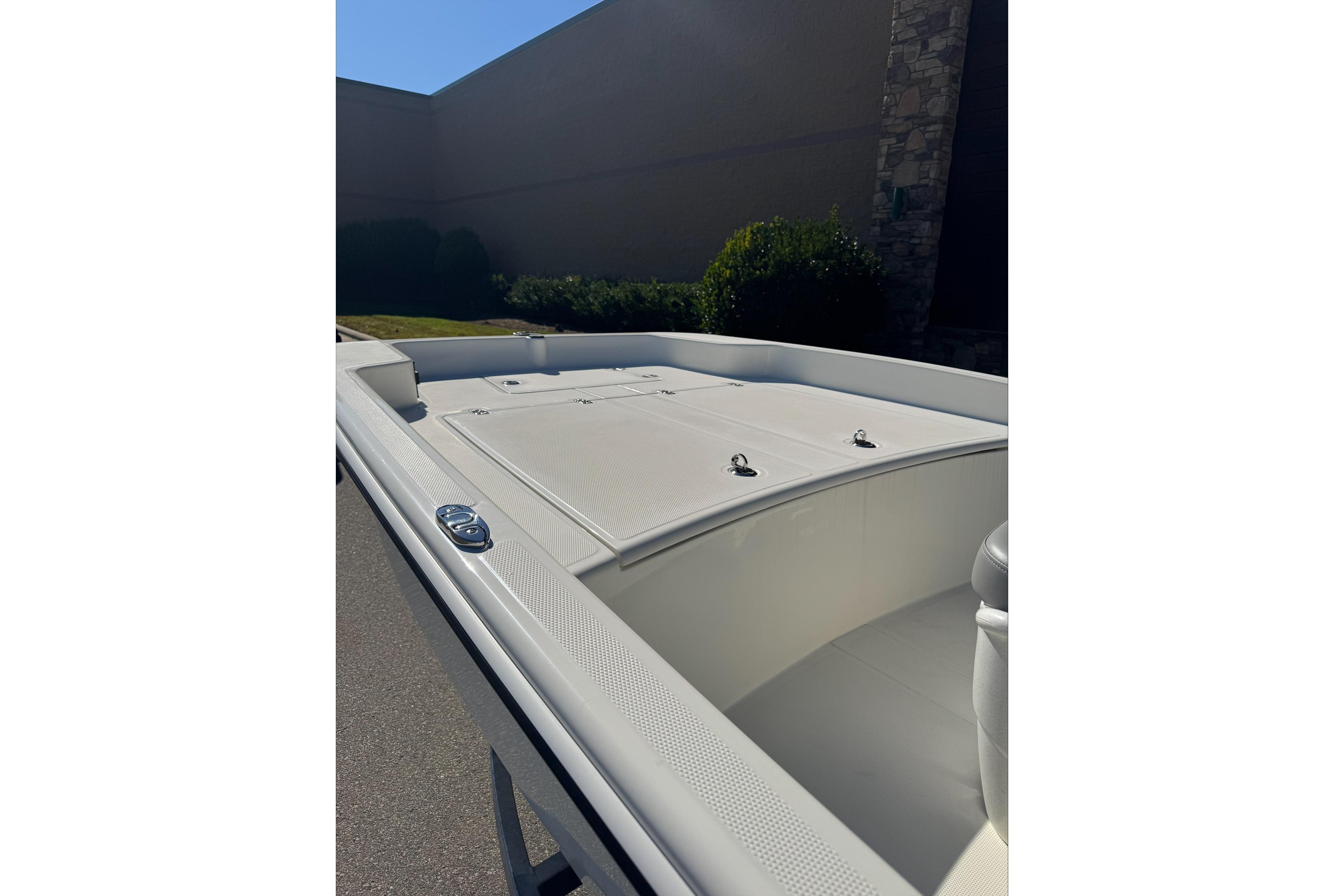 2026 Mako Pro Skiff 17 CC boat deck, featuring storage compartments and sleek design.