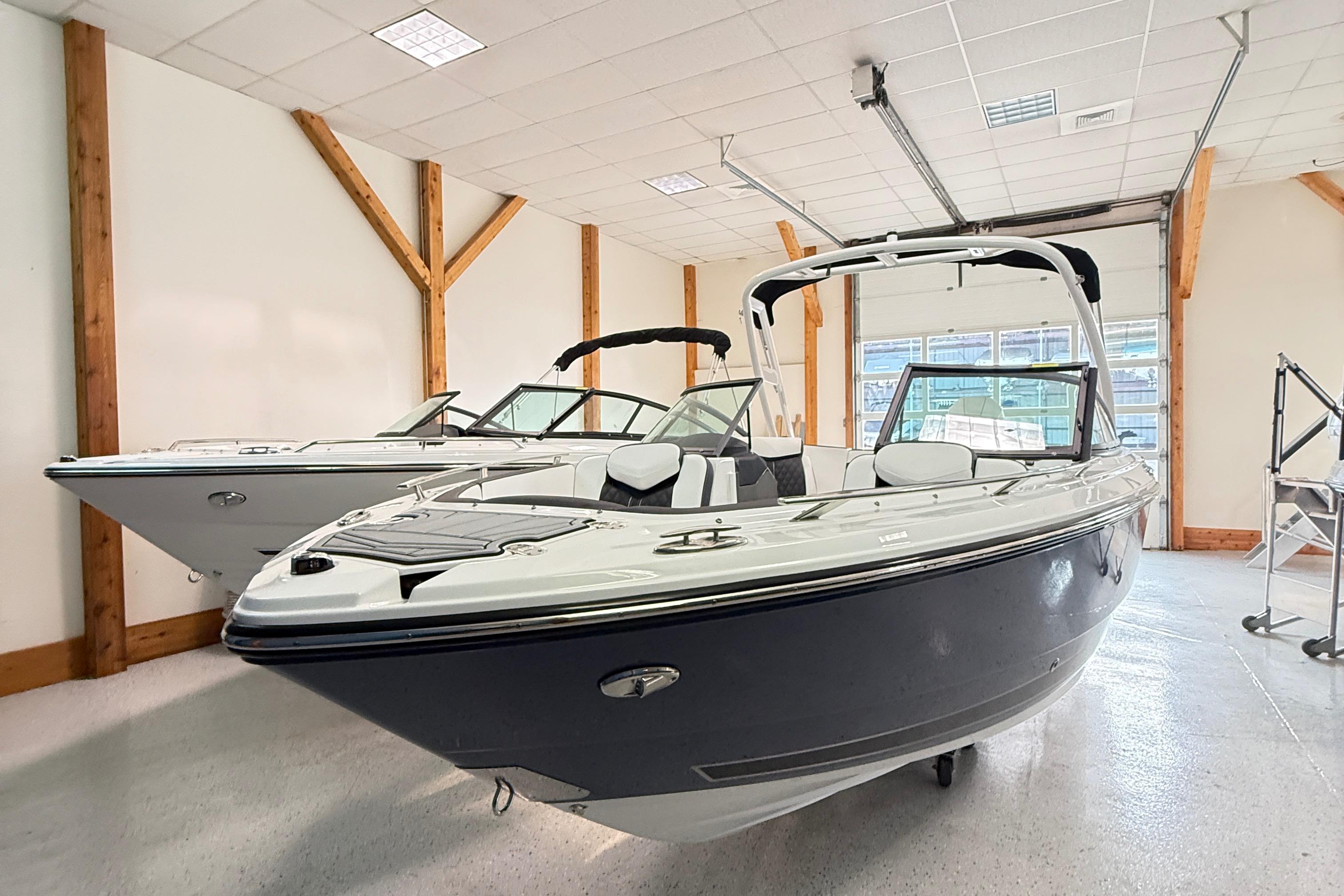 2025 Monterey 235SS Super Sport boat in showroom, sleek design, modern features.