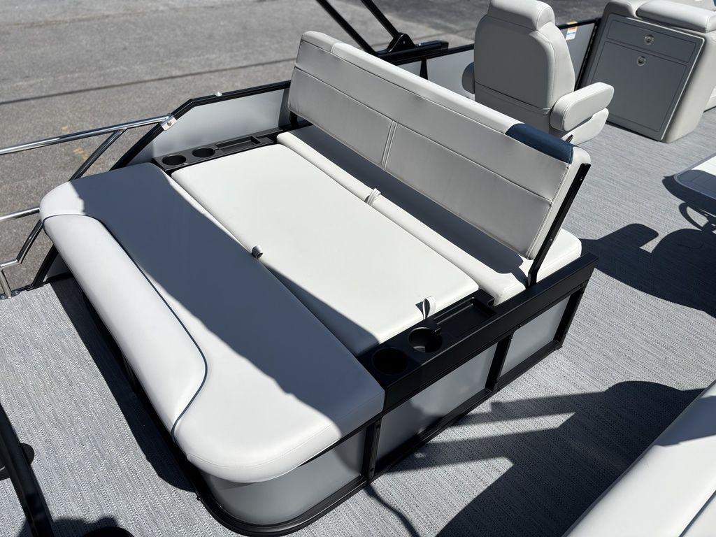 2026 Godfrey SWEETWATER 2286 SFL boat interior with white cushioned seating and cup holders.