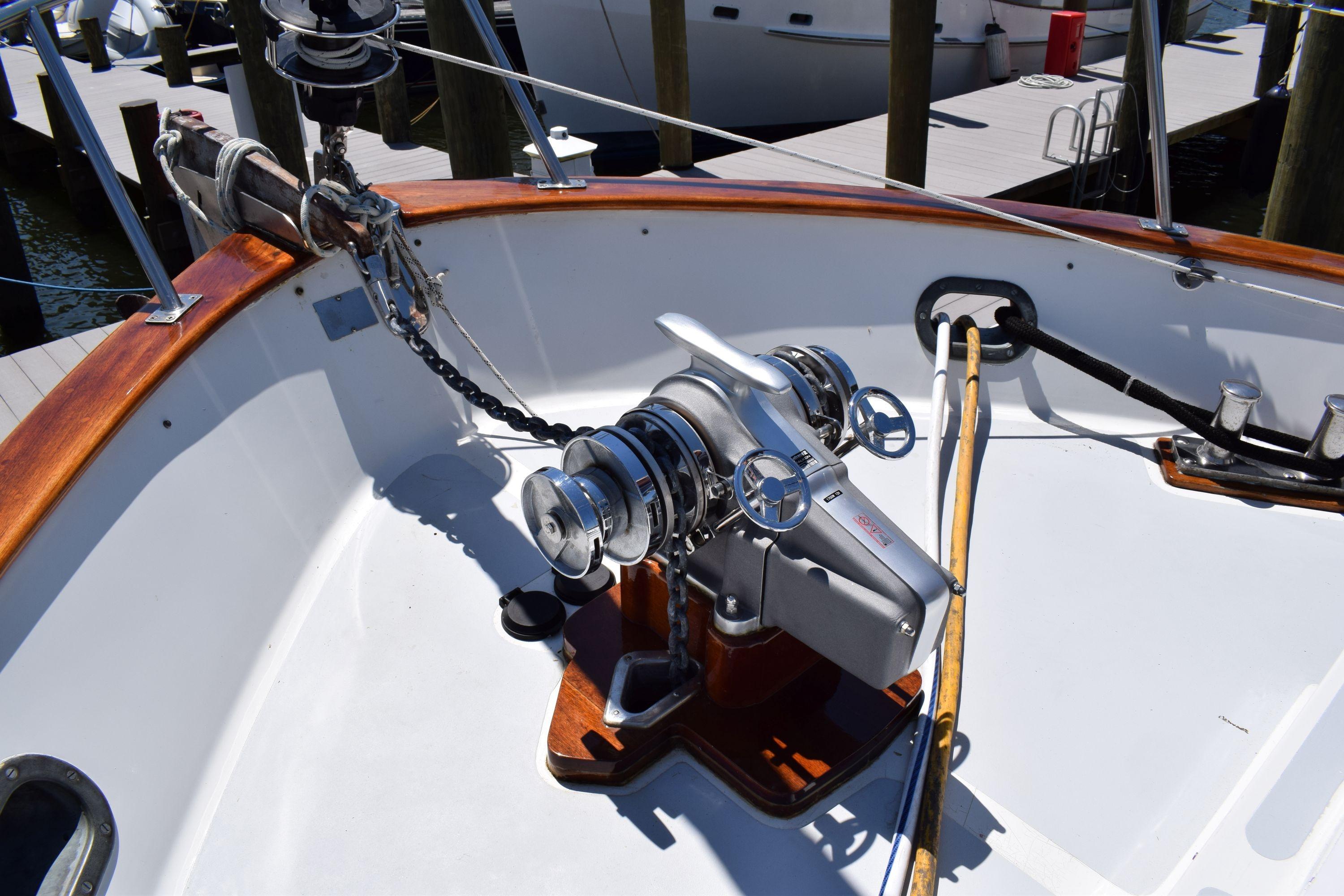 Deck of 1980 Cheoy Lee 52 Motorsailer with winch and wooden accents.