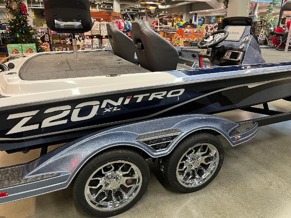 2025 Nitro Z20 XL Pro boat with sleek design and shiny chrome wheels.