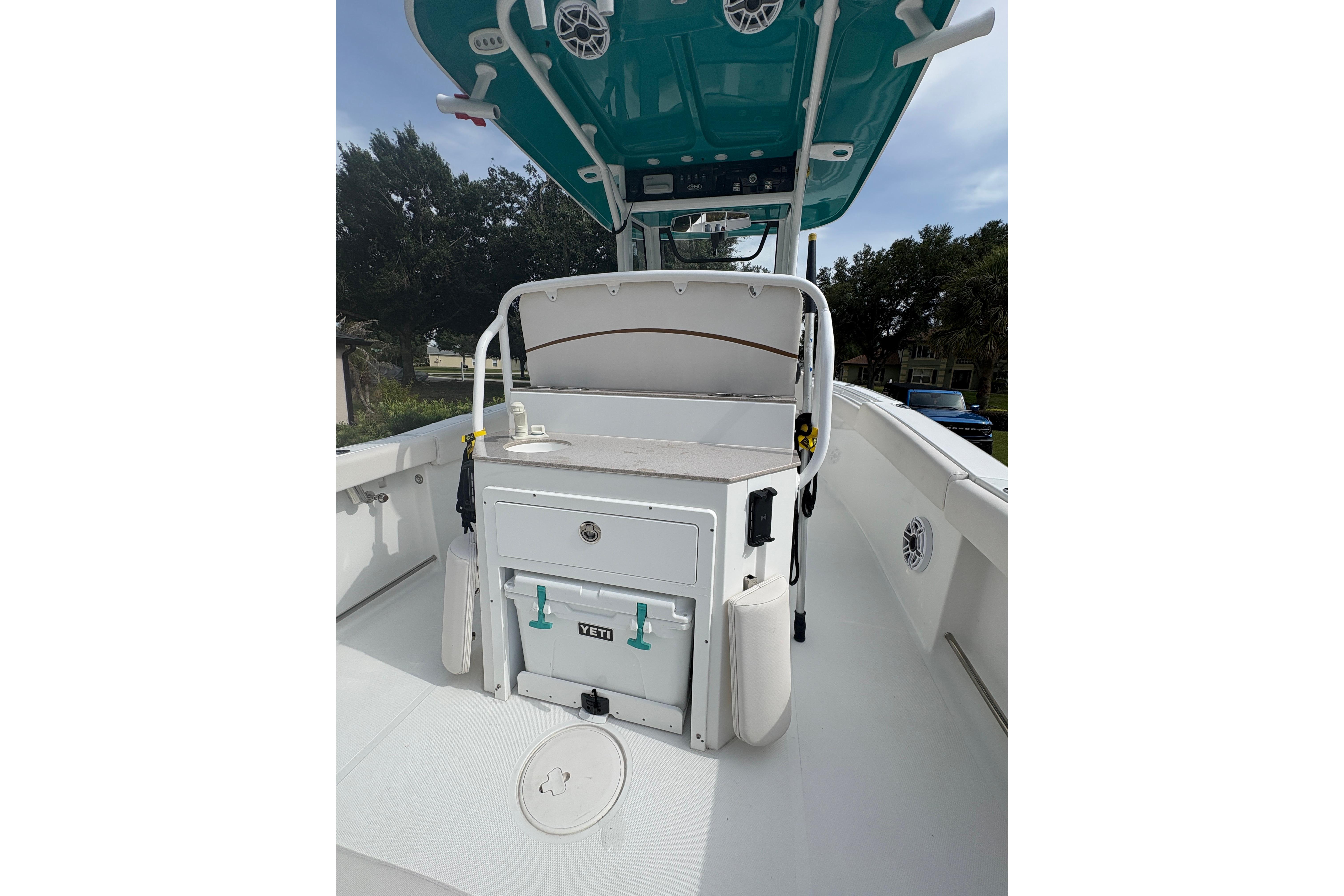 2021 Sea Hunt Ultra 265 SE boat interior with console and storage.
