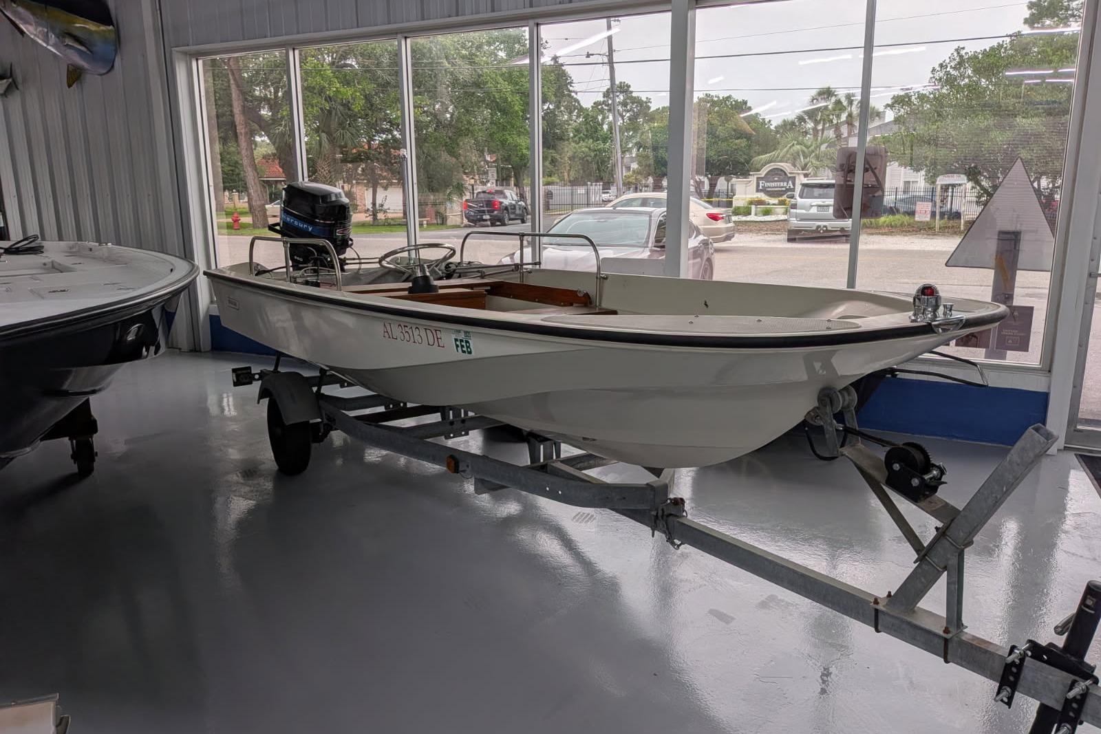 1978 Boston Whaler 15 SPORT boat on trailer in showroom.