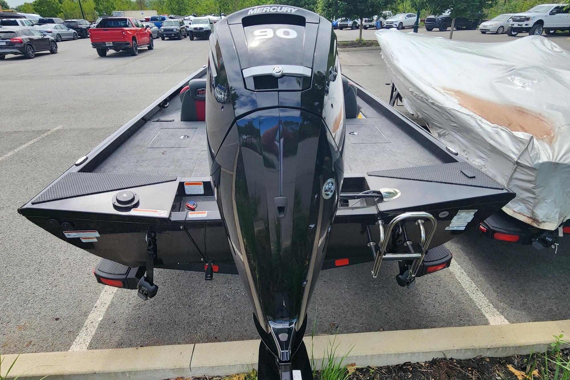 2026 Ranger RT188 boat with Mercury engine in a parking lot.