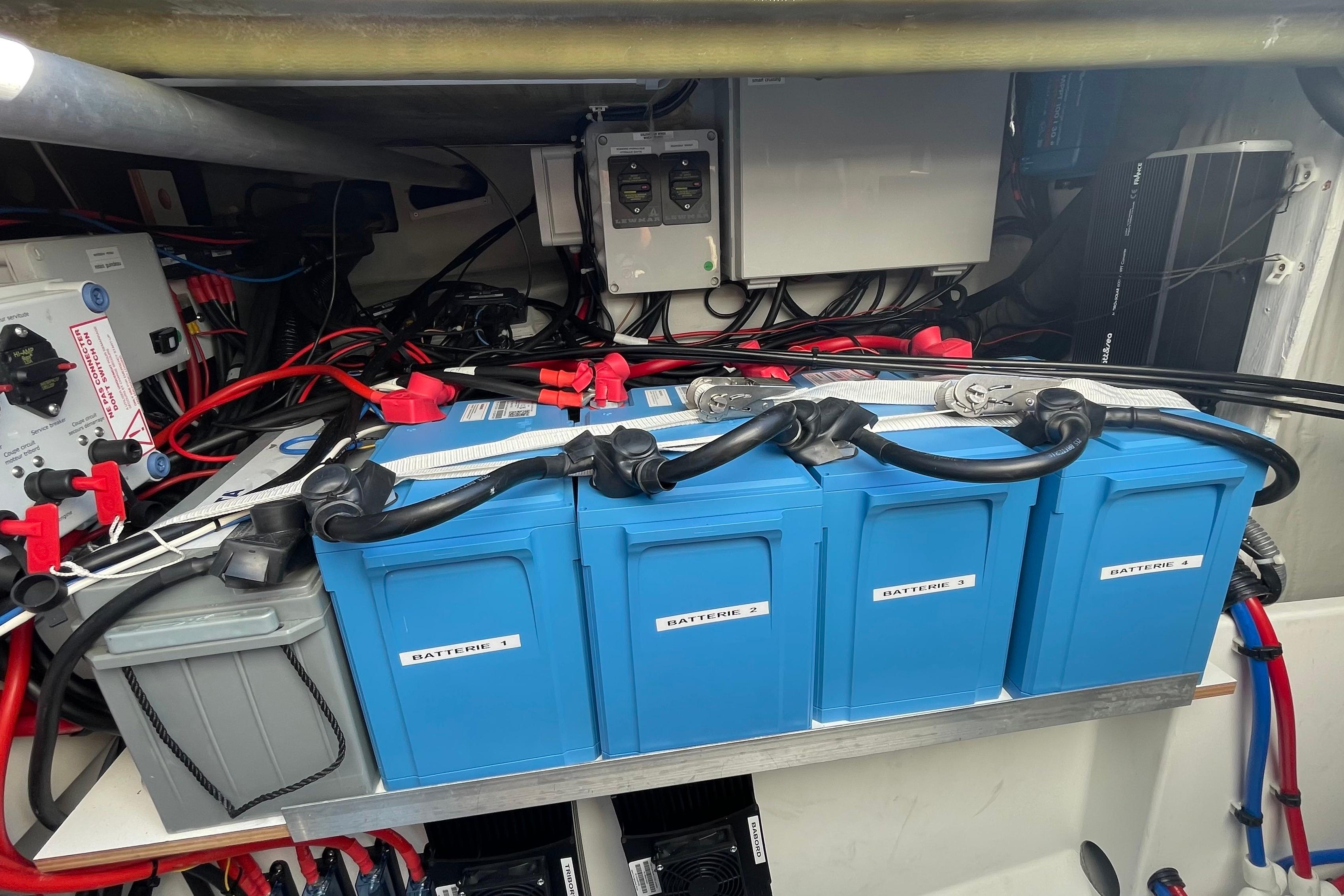 Battery compartment of a 2020 Fountaine Pajot Saona 47 catamaran, featuring organized wiring and components.
