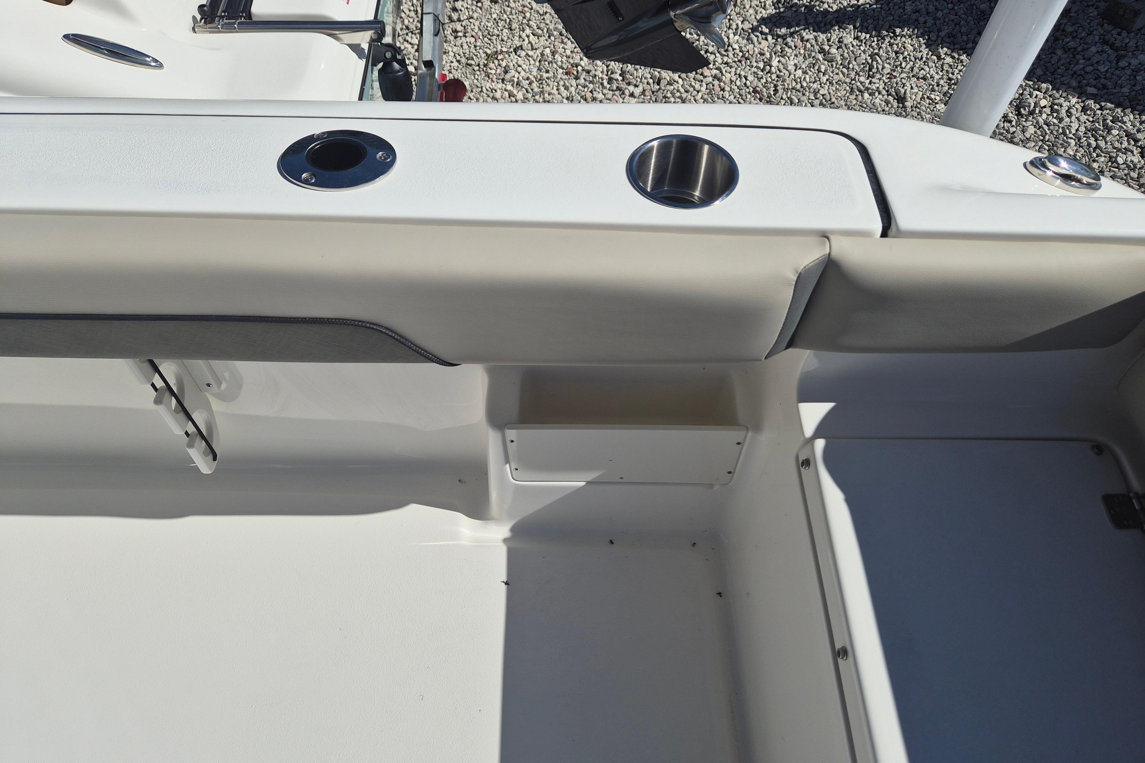 Interior view of 2026 Key West 239 FS boat, featuring cup holders and seating area.
