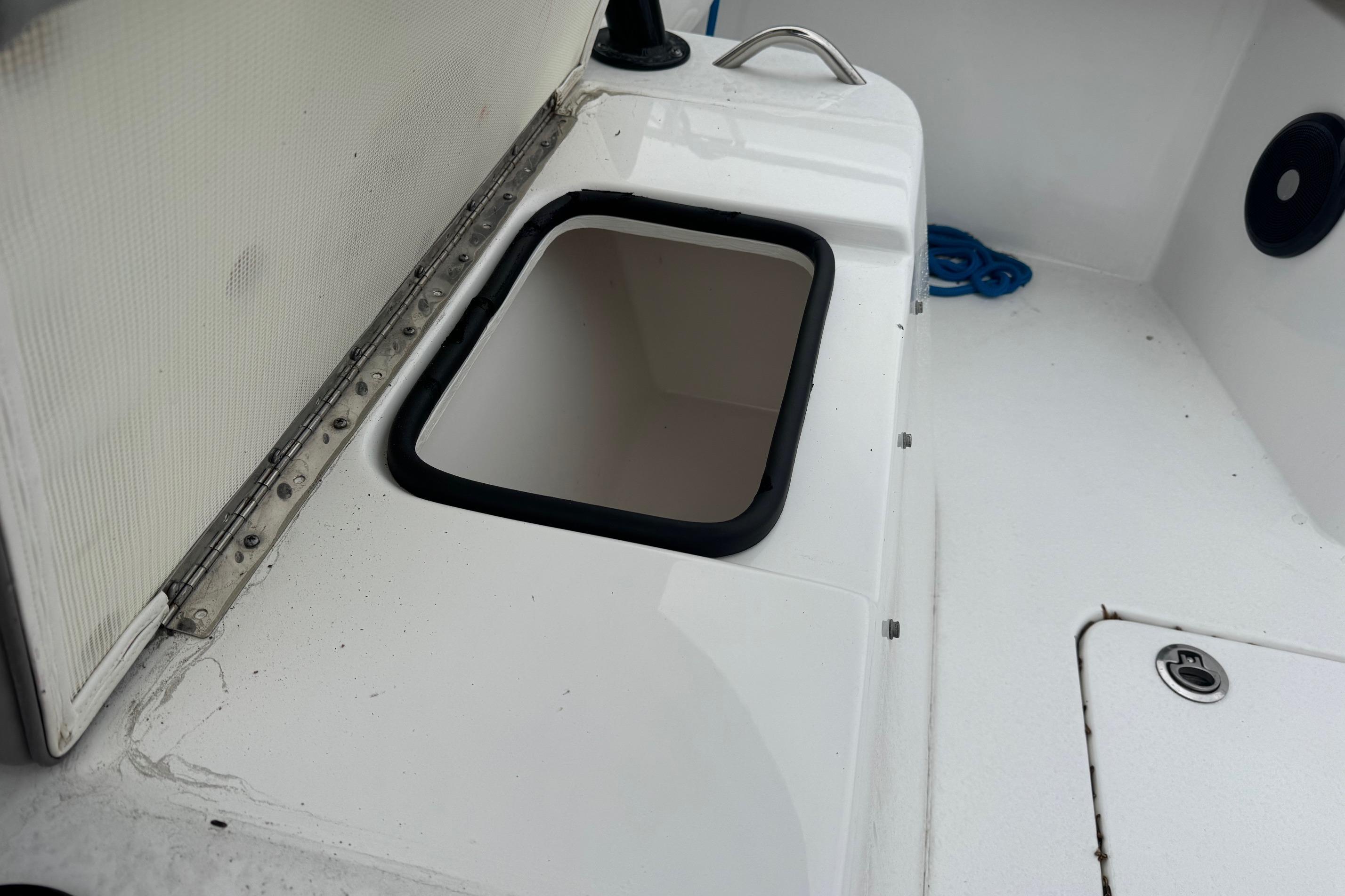 2024 Cape Horn 32 XS boat interior with storage compartment and handle.