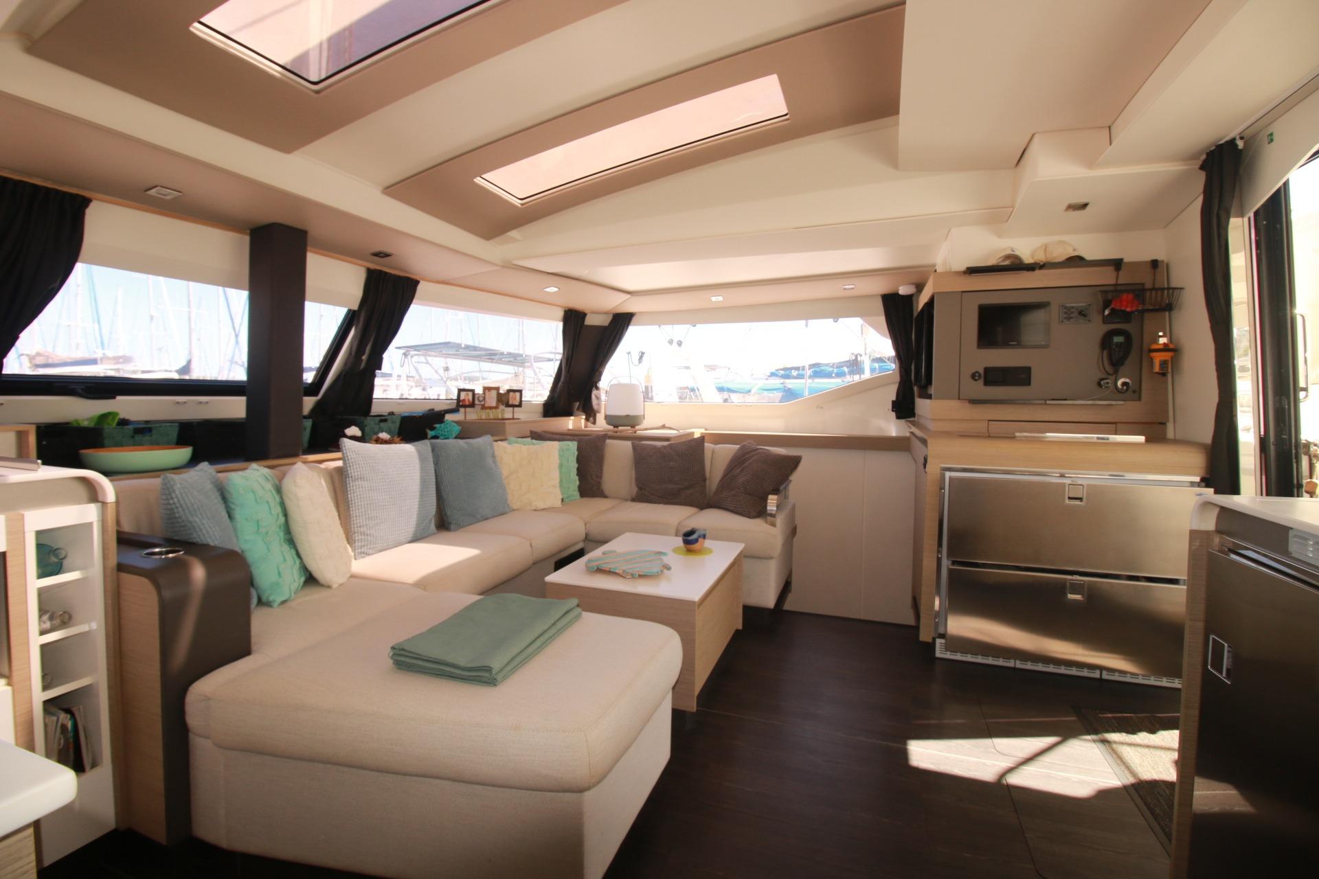 Luxurious interior of 2022 Fountaine Pajot Elba 45 Catamaran with modern furnishings and ample natural light.