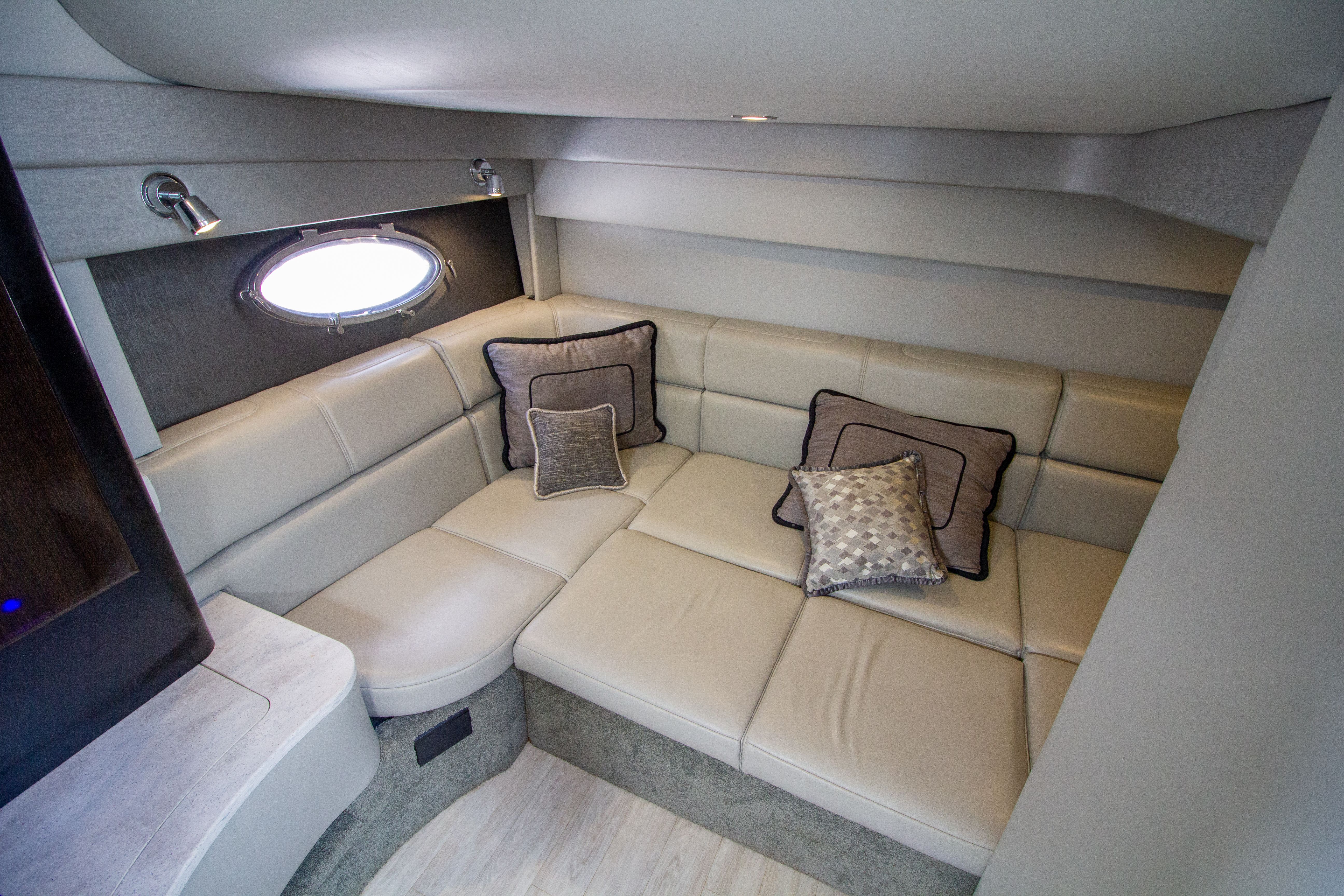 Interior of 2016 Formula 40 Performance Cruiser with beige sofa.