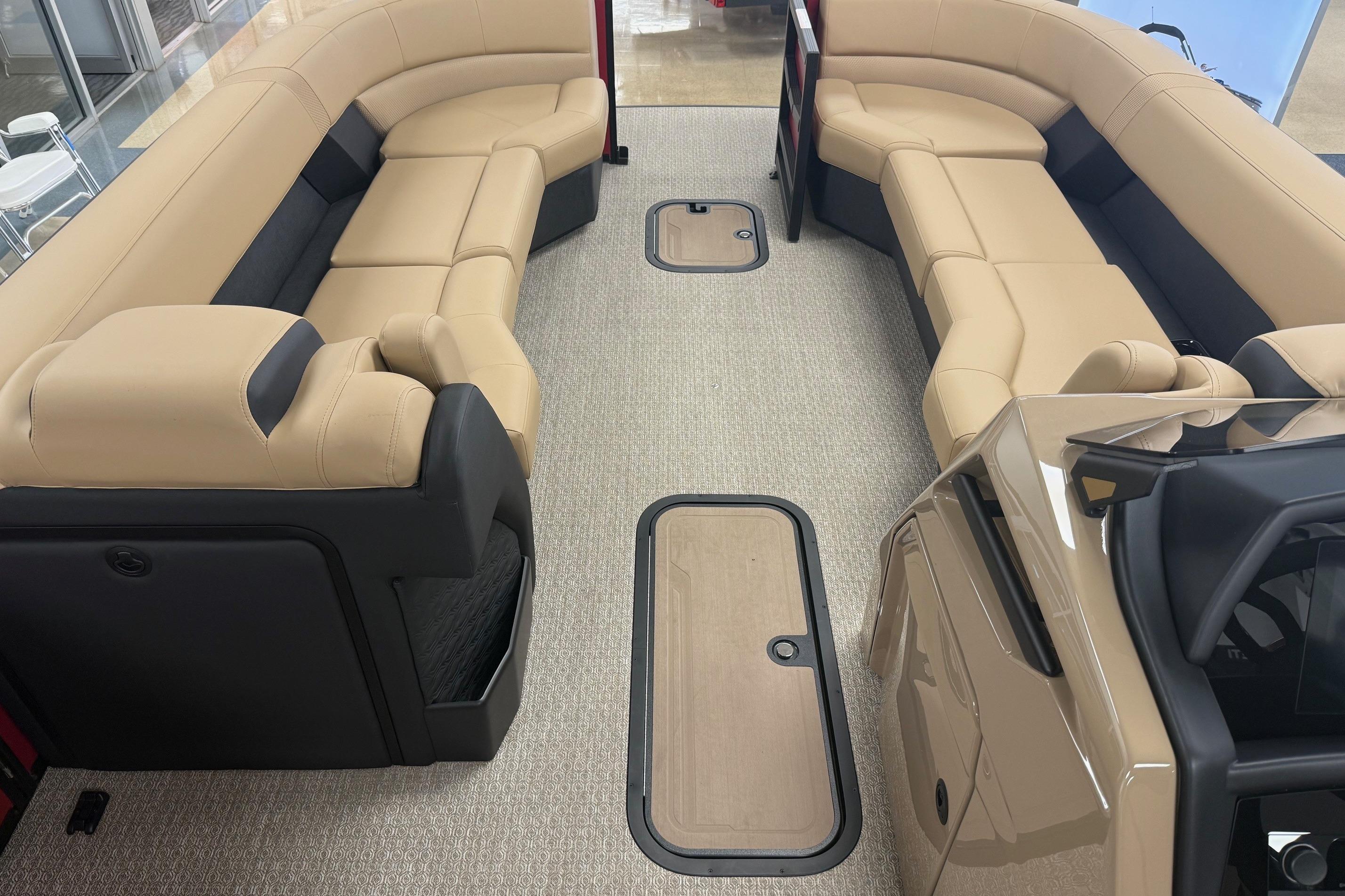 Luxurious interior of 2026 Evotti 725CS boat with beige seating and modern design.