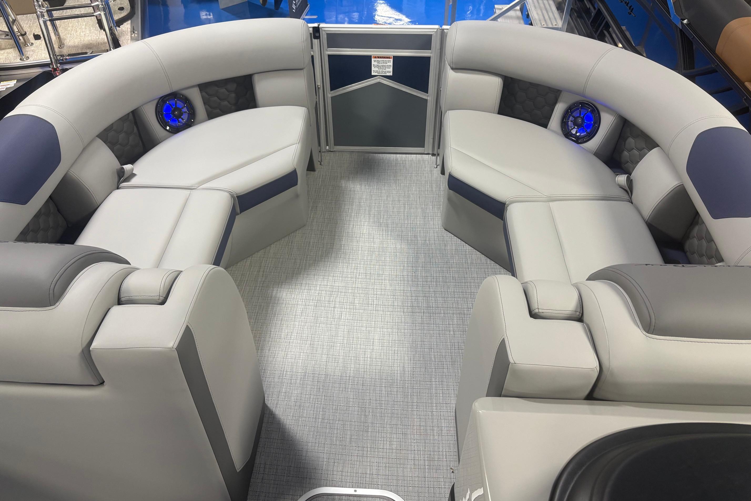 Luxurious interior of 2026 South Bay 523RS pontoon boat with plush seating and modern design.