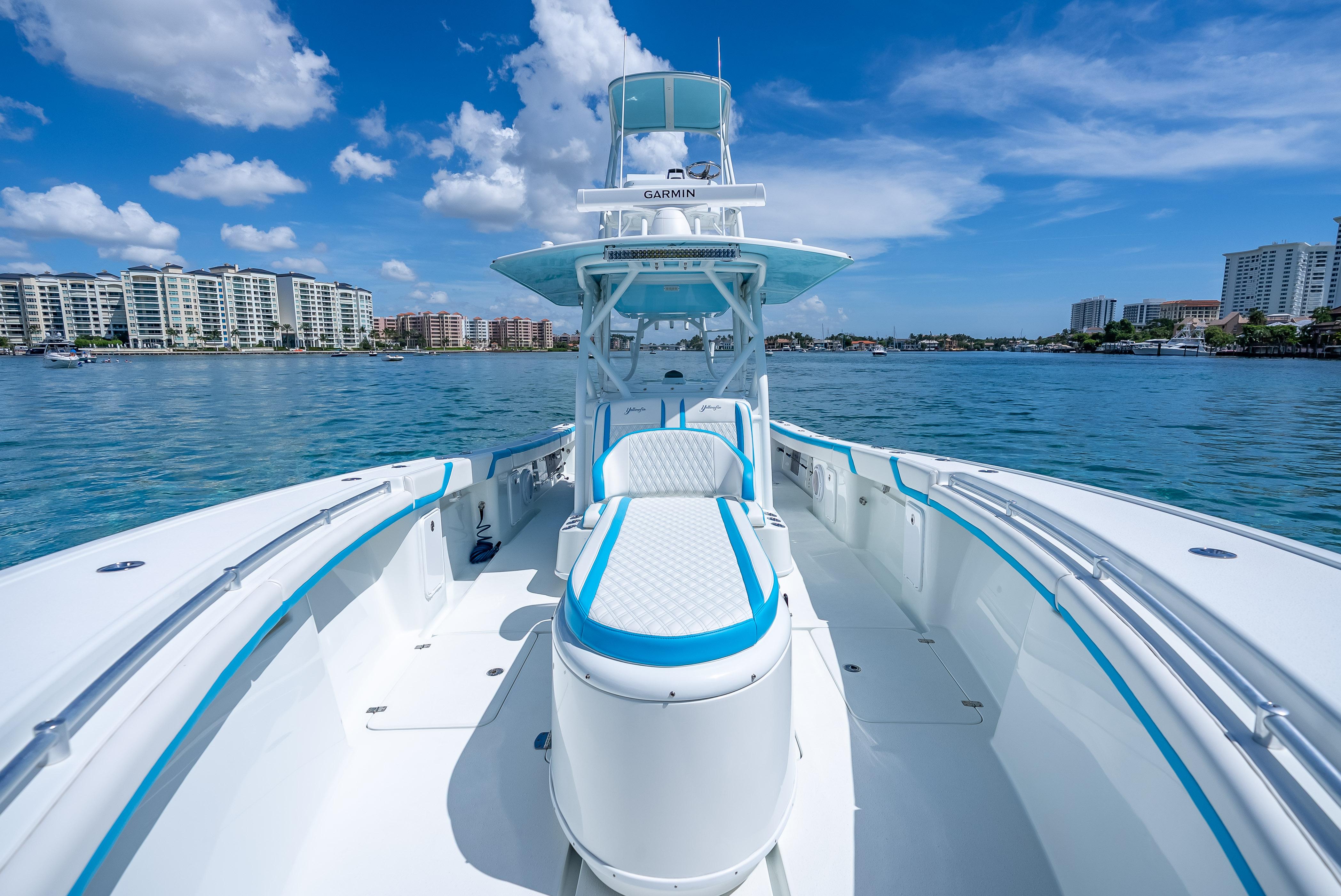 2016 Yellowfin 39 Offshore boat on water, clear sky, city skyline in background.