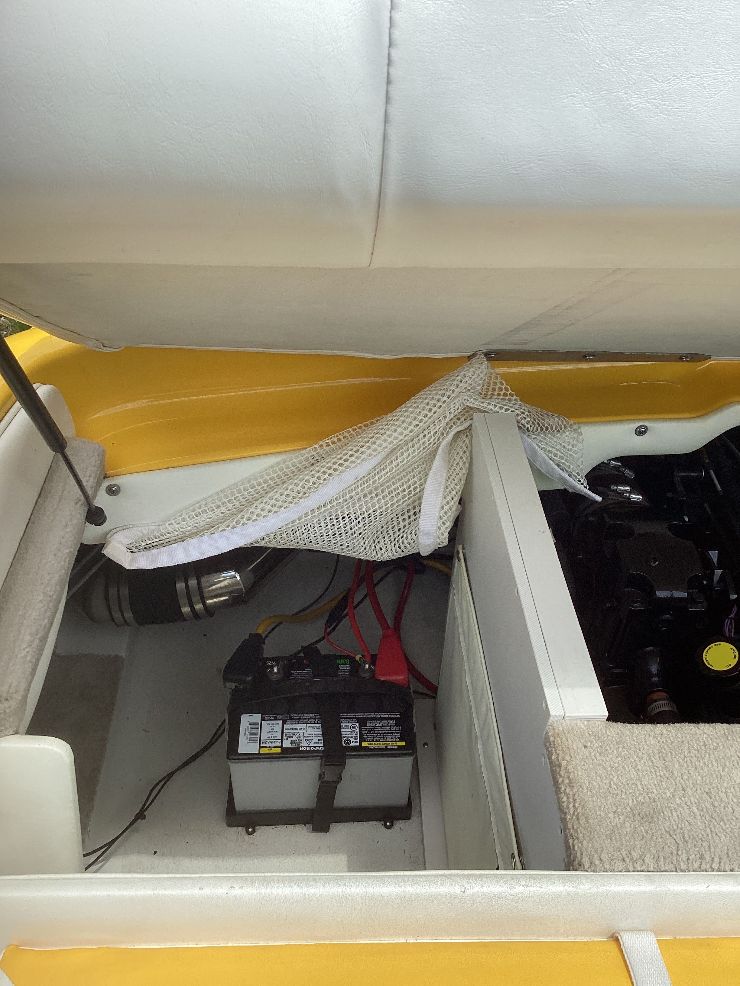 Battery and engine compartment of a 2005 Crownline 202 BR LPX boat.