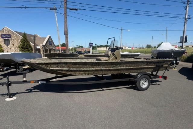 2026 Tracker Grizzly 1860 CC boat on trailer in outdoor setting.