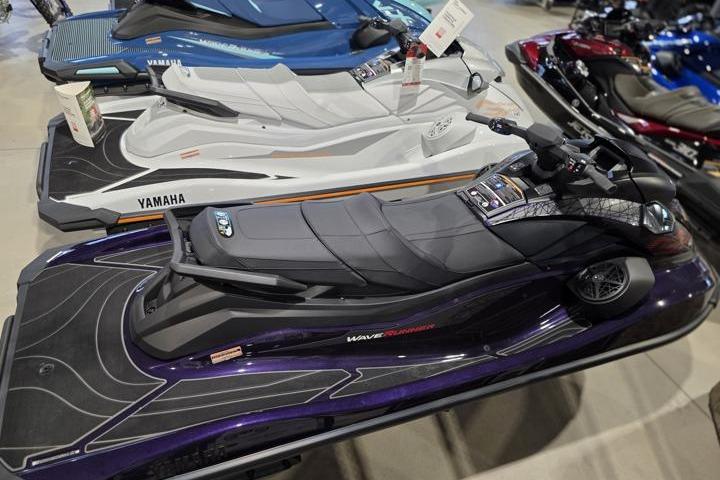 2026 Yamaha WaveRunner GP HO jet ski in showroom, sleek design, black and purple color scheme.