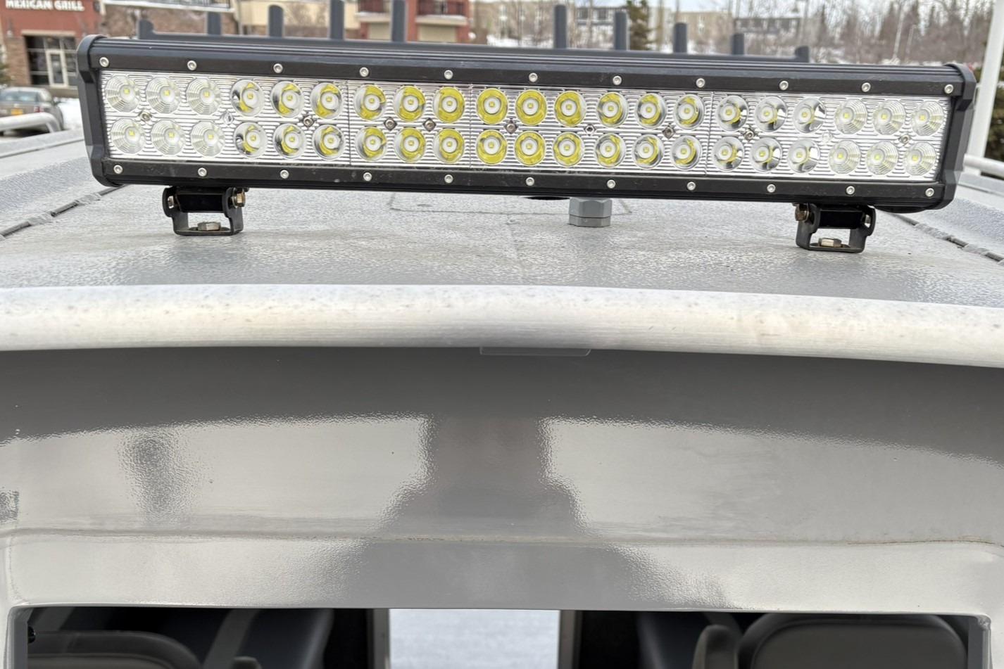 2024 Spartan 26 Maximus Pro XL with LED light bar on roof.