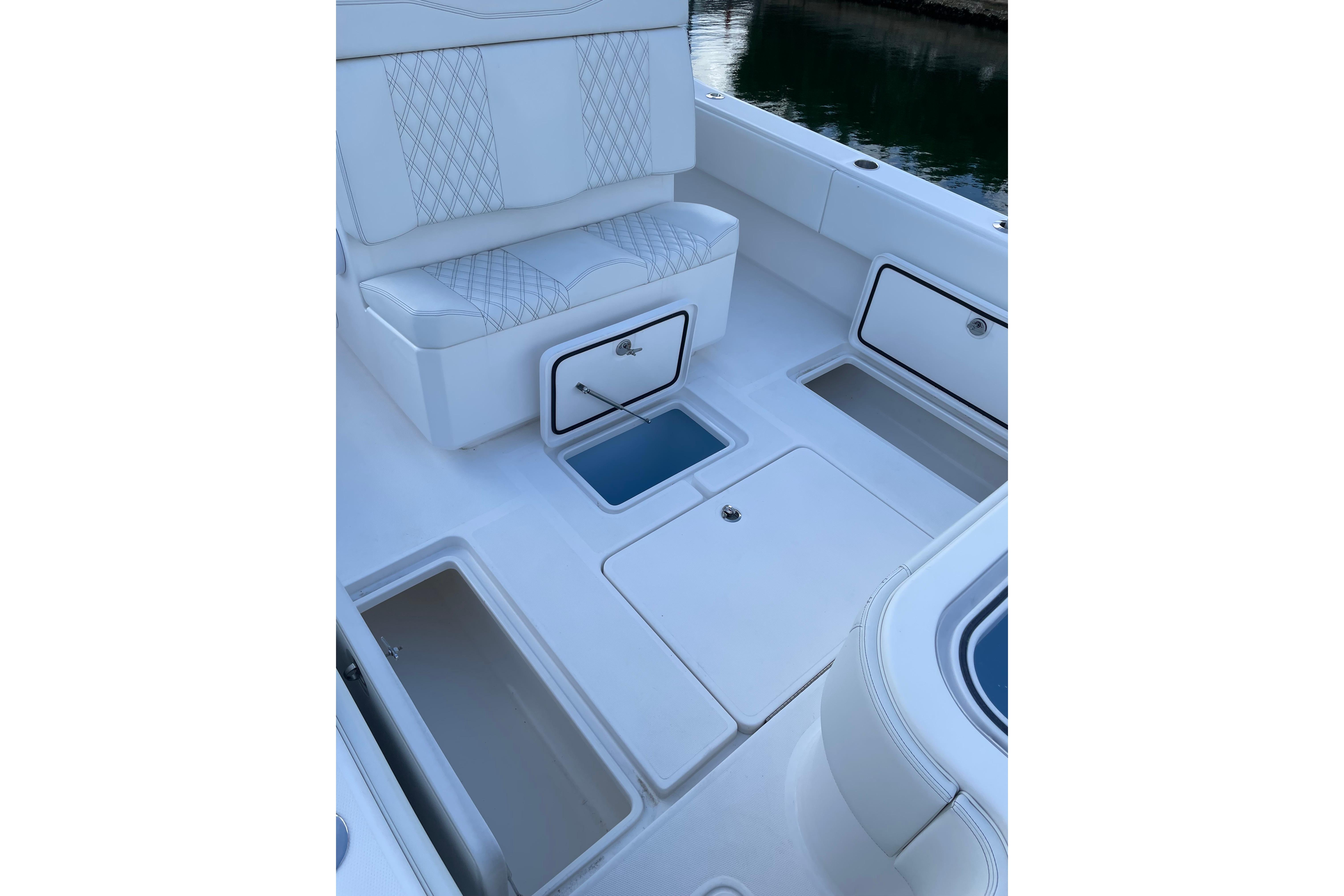 2024 Invincible 36 Open Fisherman boat interior with storage compartments and seating.