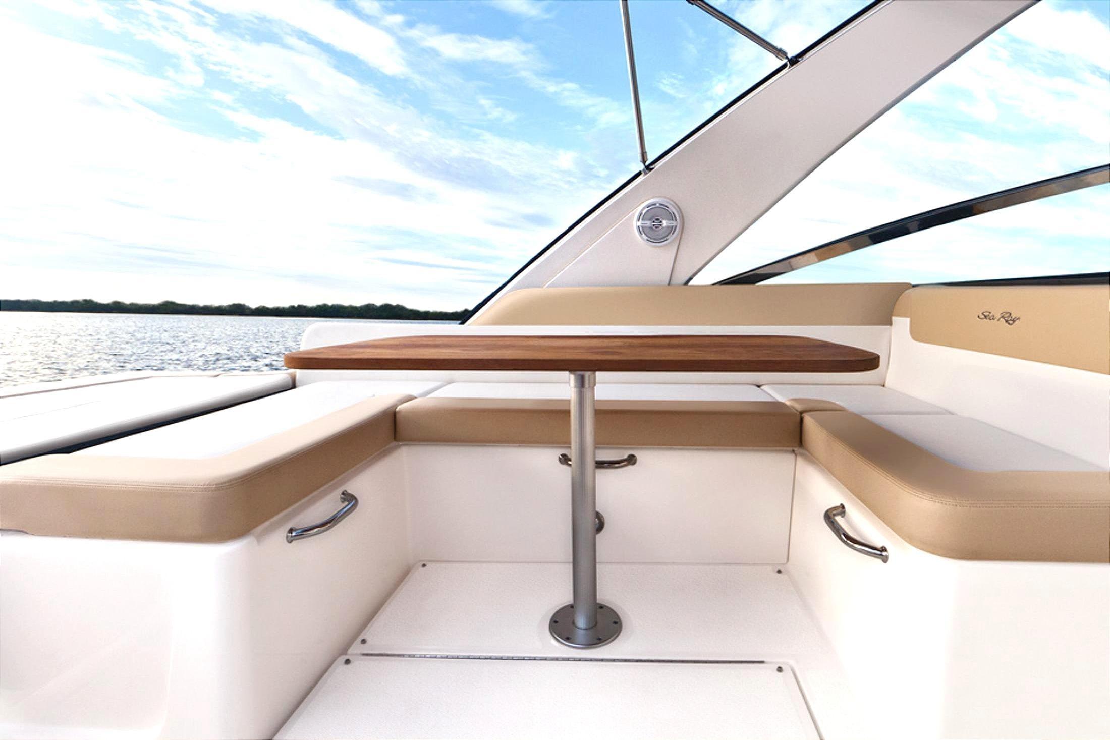 Manufacturer Provided Image: 2013 Sea Ray 370 Venture boat interior with seating and table, scenic water view.