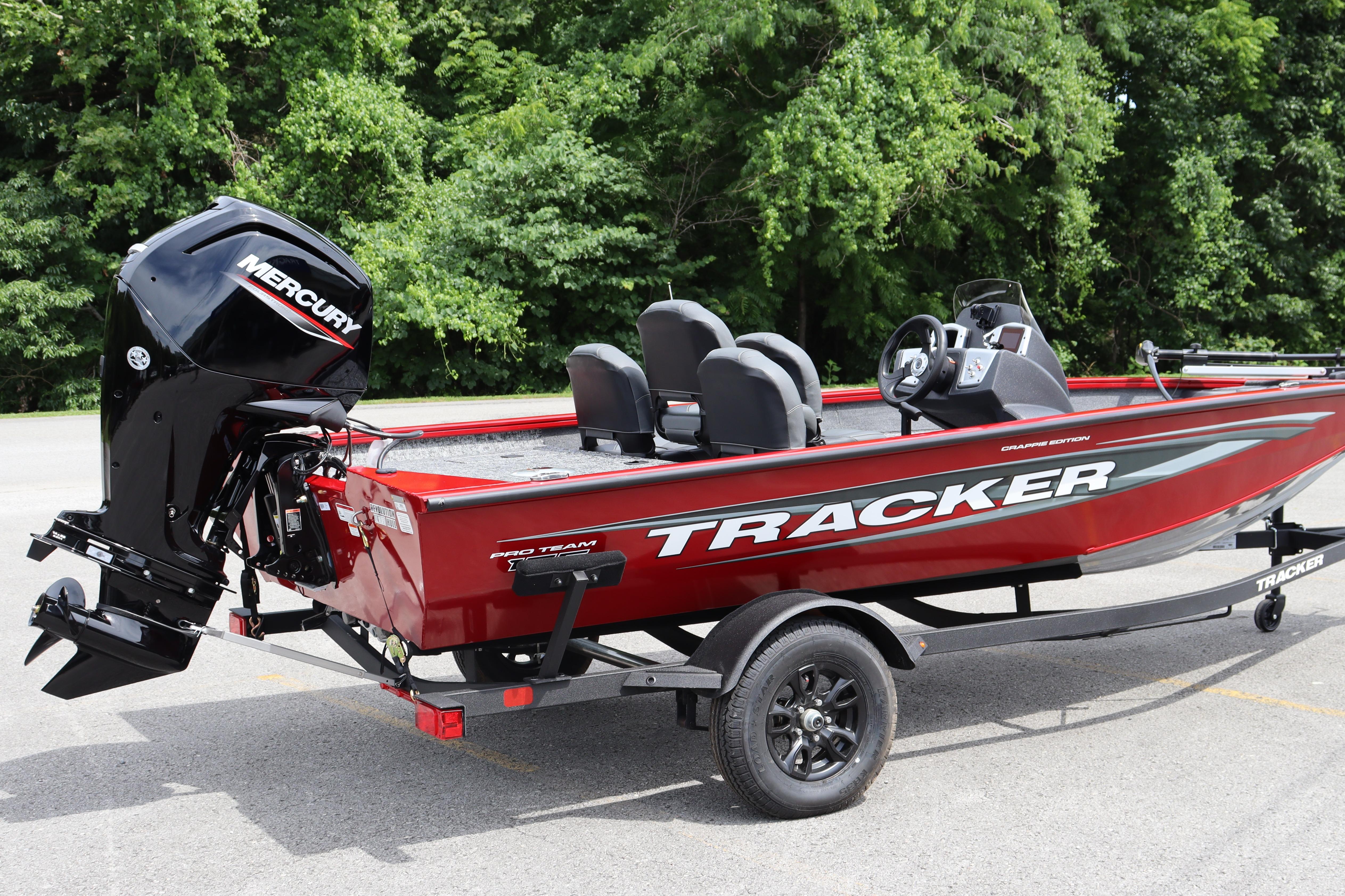 2026 Tracker Pro Team 175 Crappie Edition boat with Mercury engine, parked outdoors.