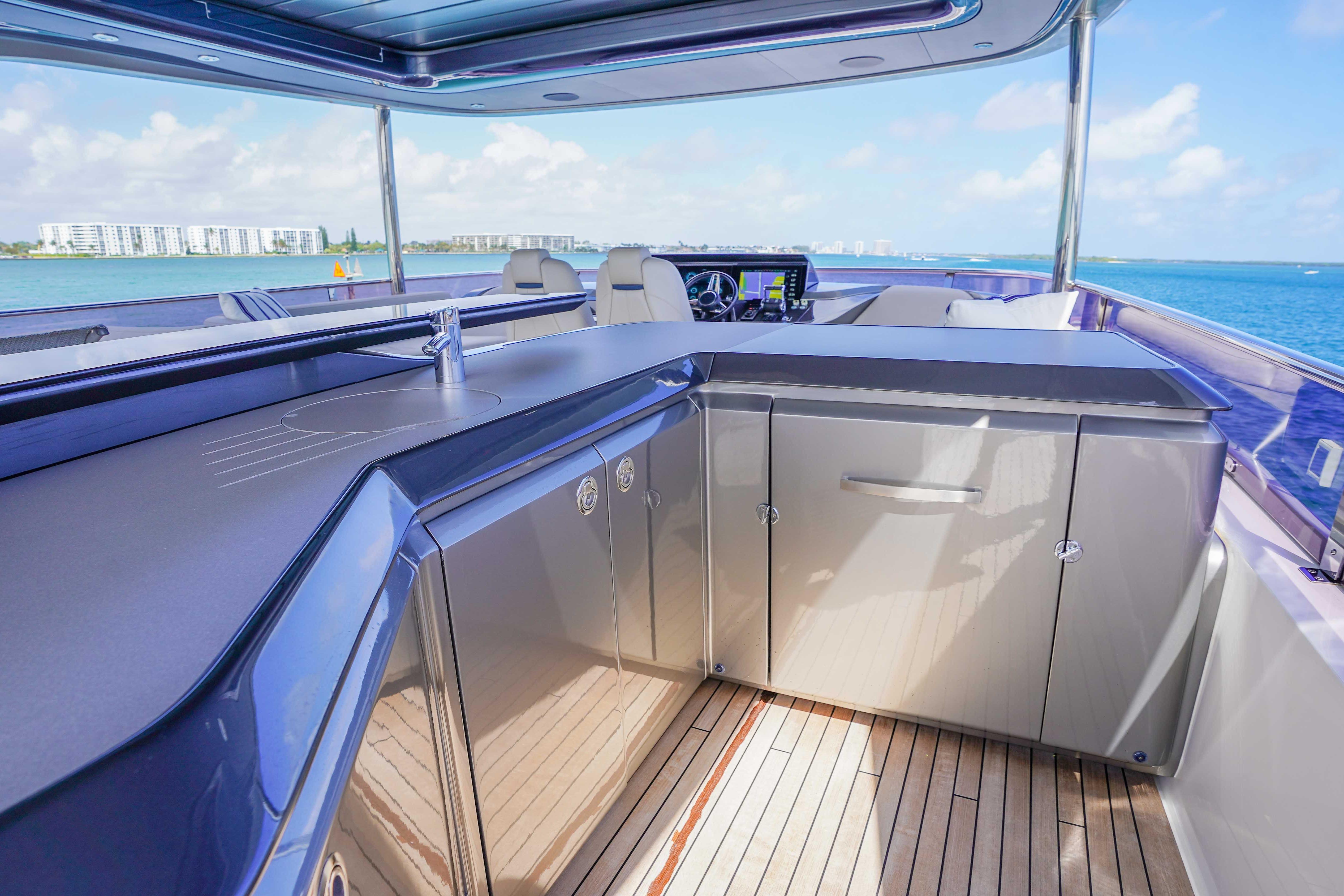 Luxurious 2021 Princess Y85 yacht deck with sleek cabinetry and ocean view.