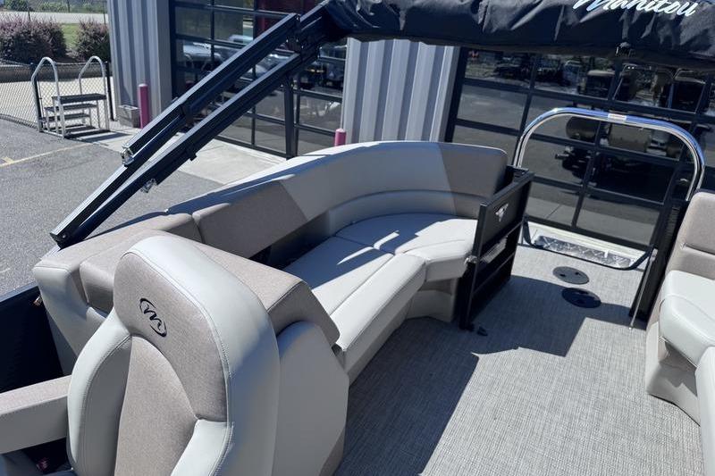 2027 Manitou Aurora 23 RF SHP pontoon boat interior with plush seating and modern design.