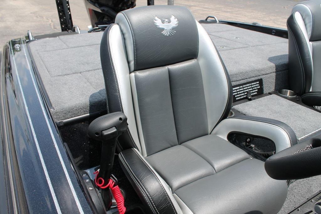2025 Phoenix 920 Elite boat interior with gray leather seats and steering controls.