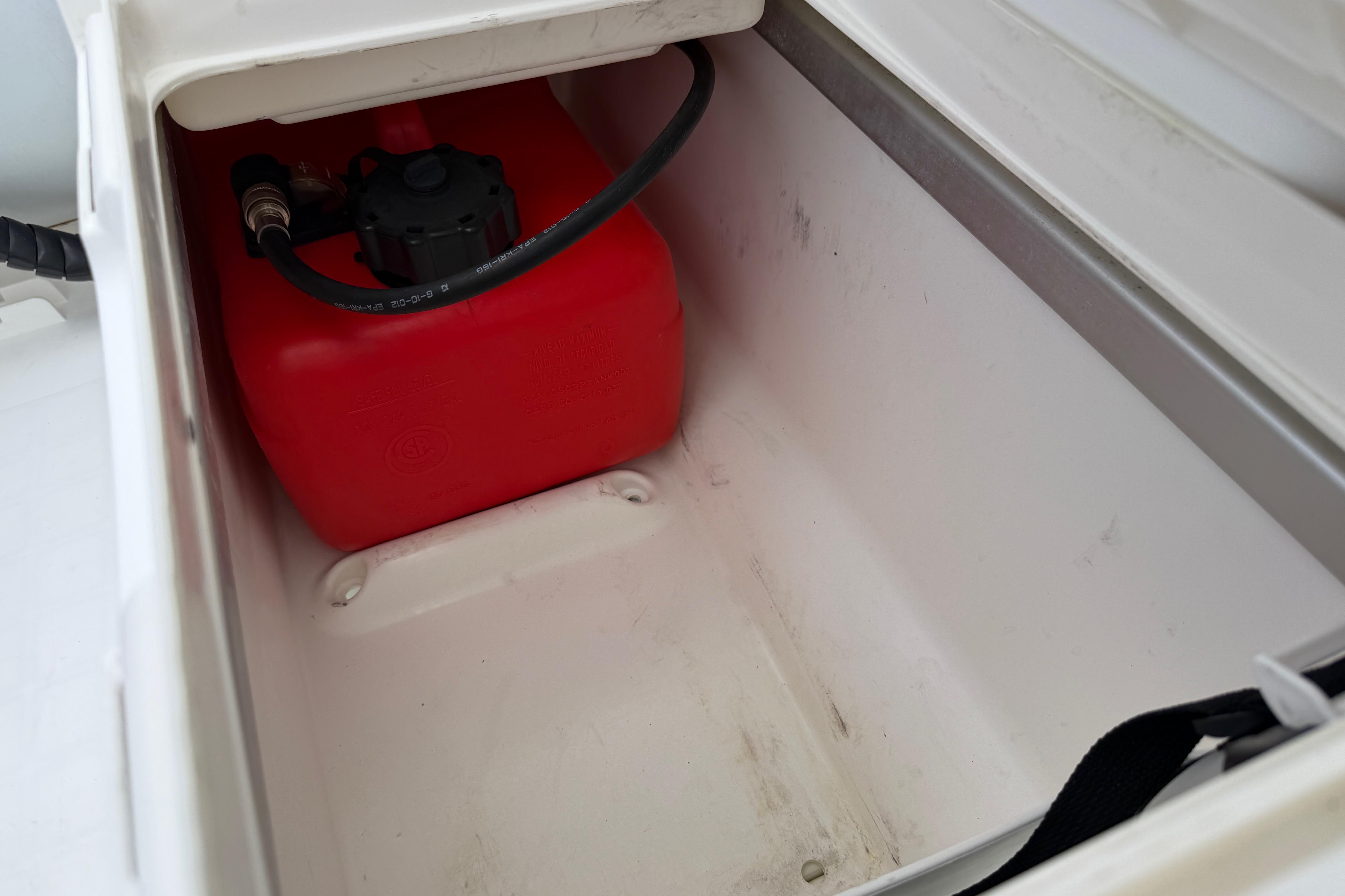 Red fuel tank inside Walker Bay Genesis G2 340DX Console storage compartment, 2017 model.