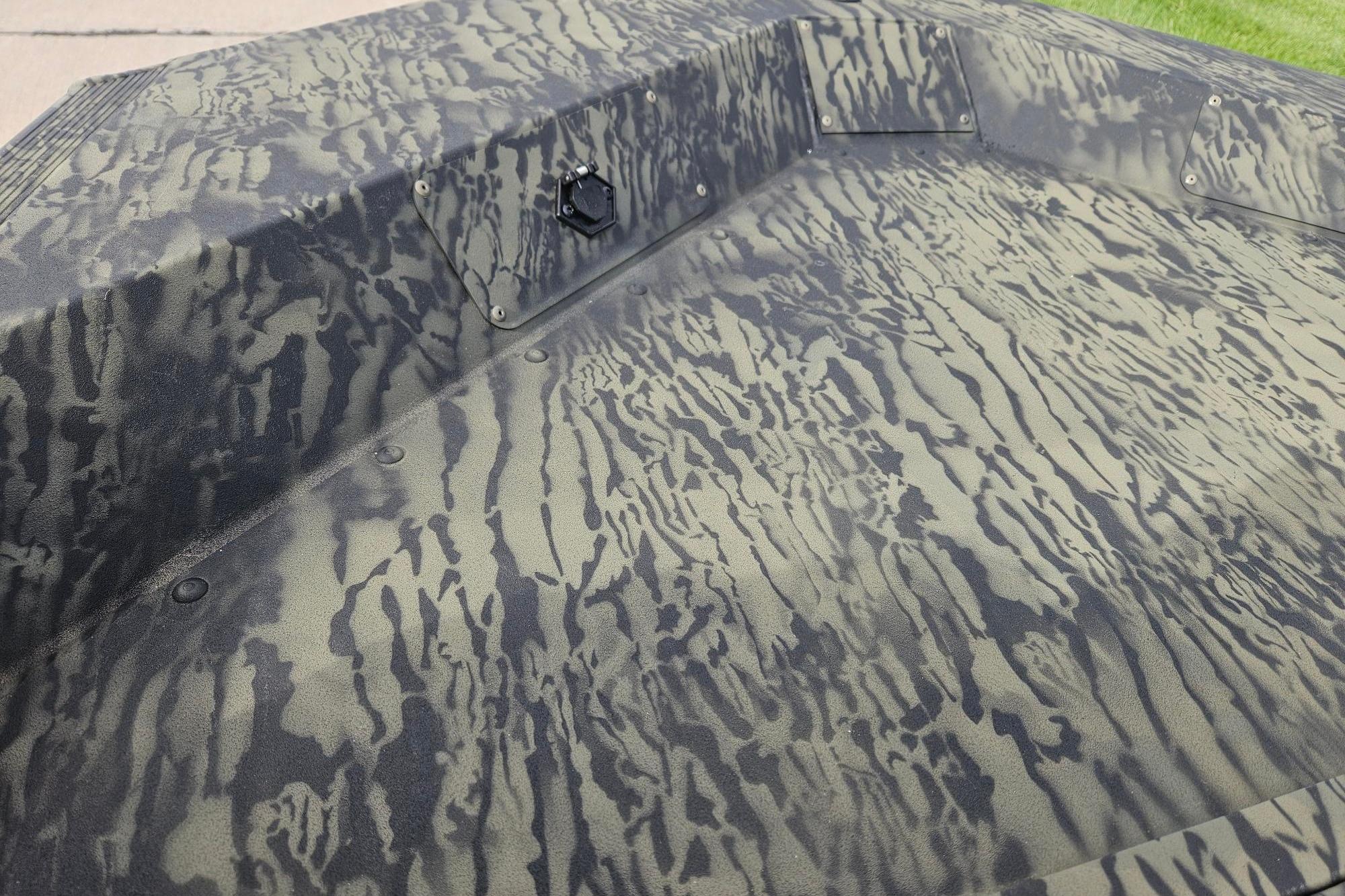 Camouflage pattern on 2026 Tracker Grizzly 1648 SC boat deck.