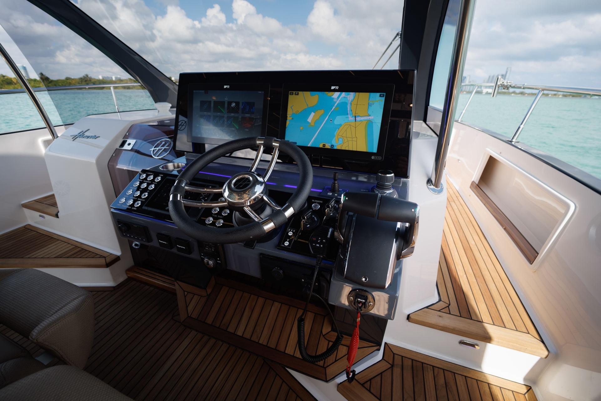 Helm of 2026 Hanover 447 yacht with advanced navigation system and sleek design.