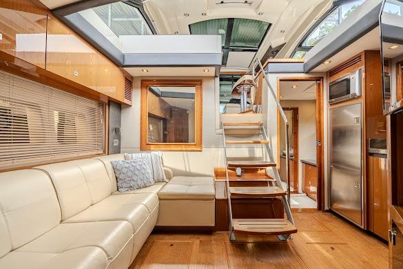 Luxurious interior of 2016 Sea Ray Sundancer 510 yacht with modern furnishings and wooden accents.