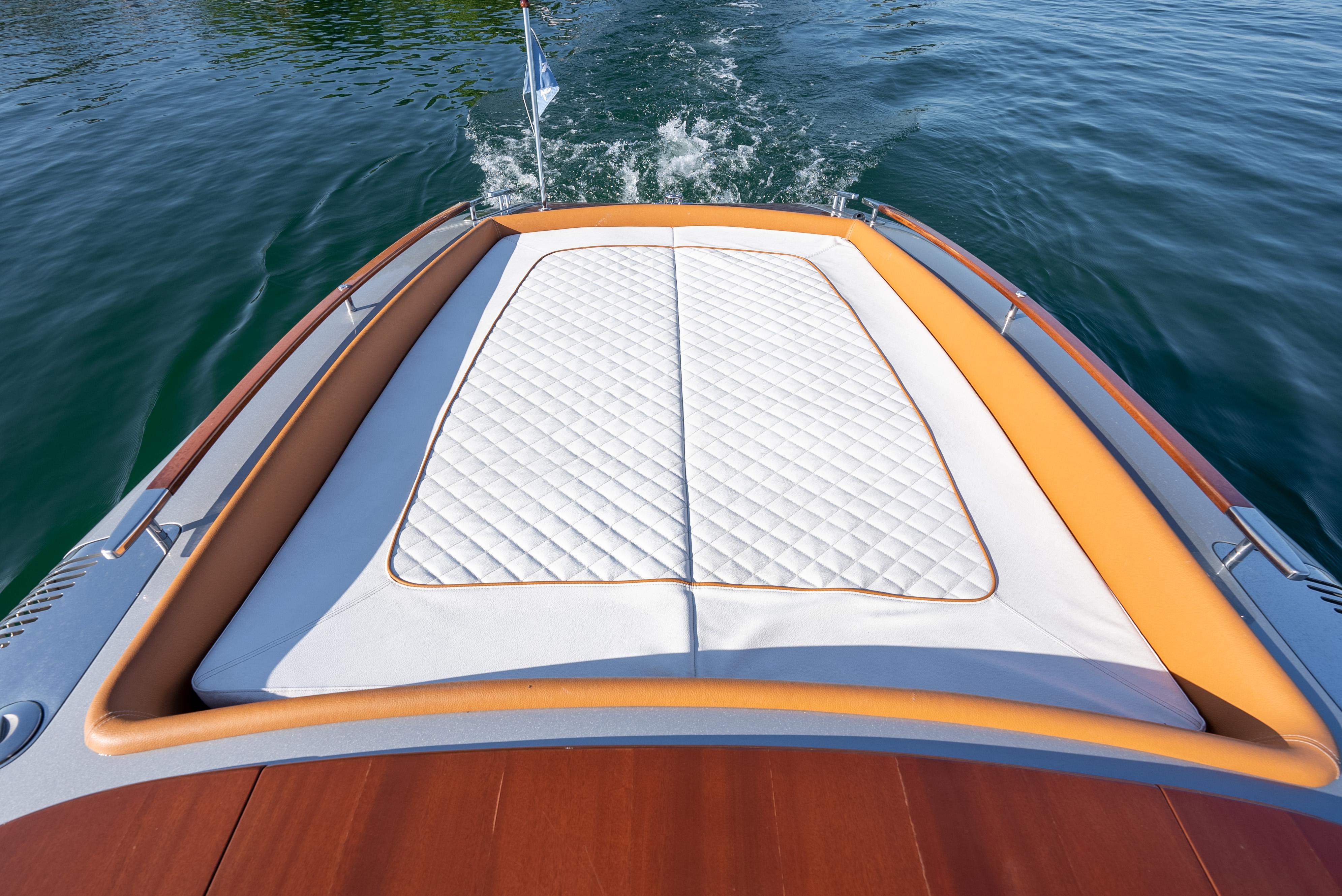 2020 Riva Aquariva boat with cushioned sunbathing area on the deck.