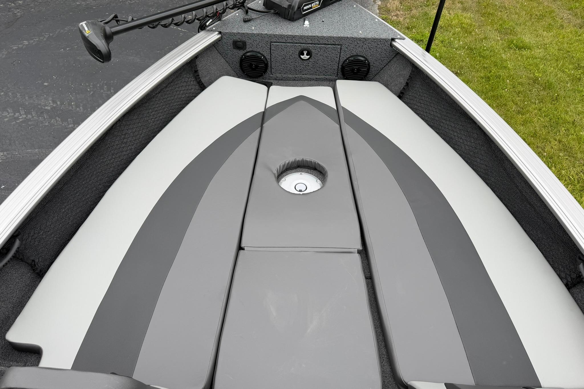 2027 Lund 2075 Impact XS boat interior with cushioned seating and trolling motor.