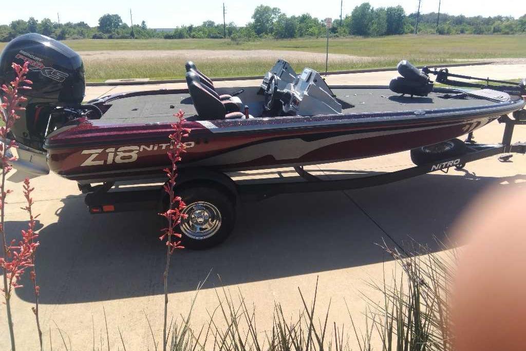 2026 Nitro Z18 boat on trailer, parked outdoors with scenic background.