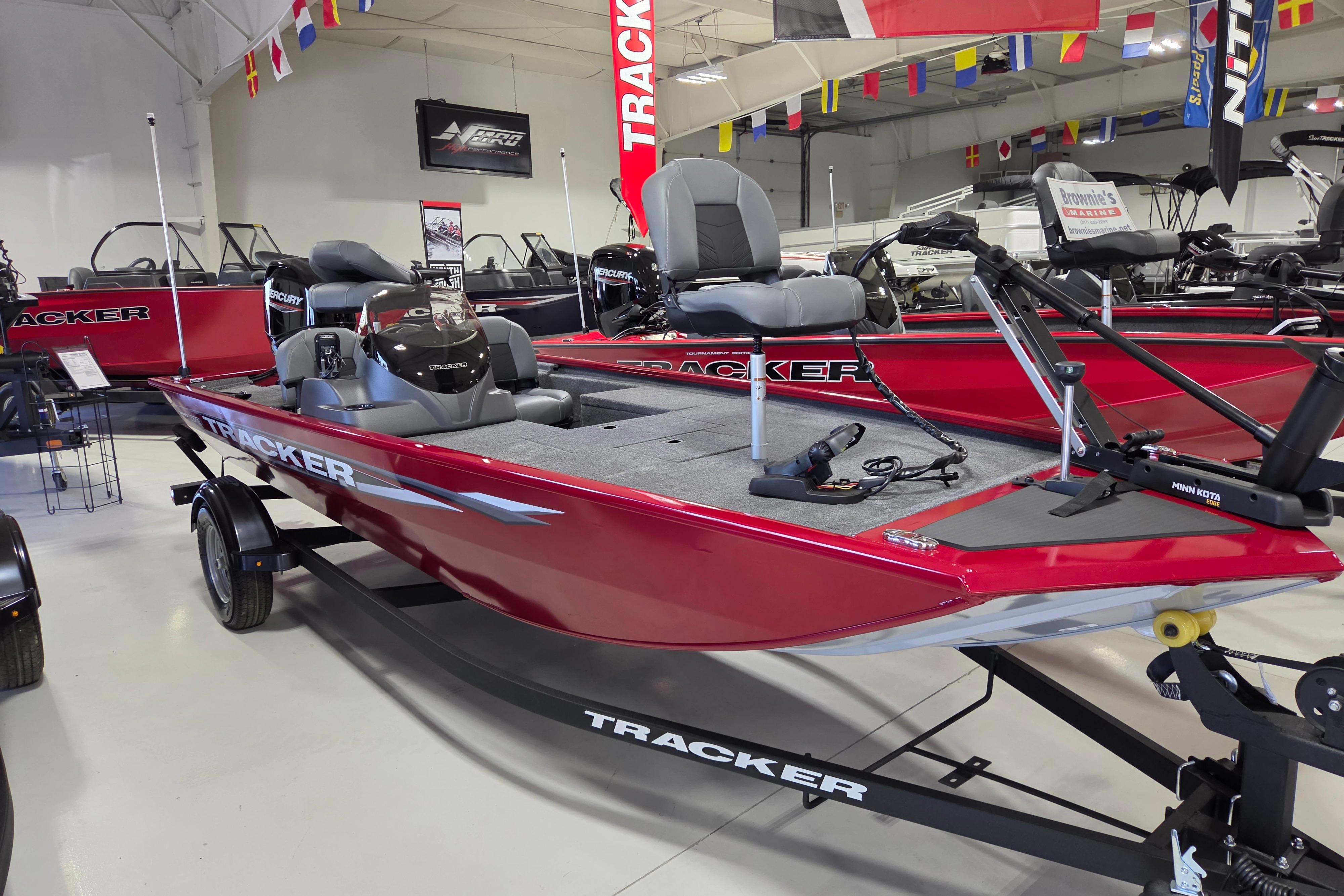 2026 Tracker Pro 170 boat in showroom, red exterior, equipped with modern features.