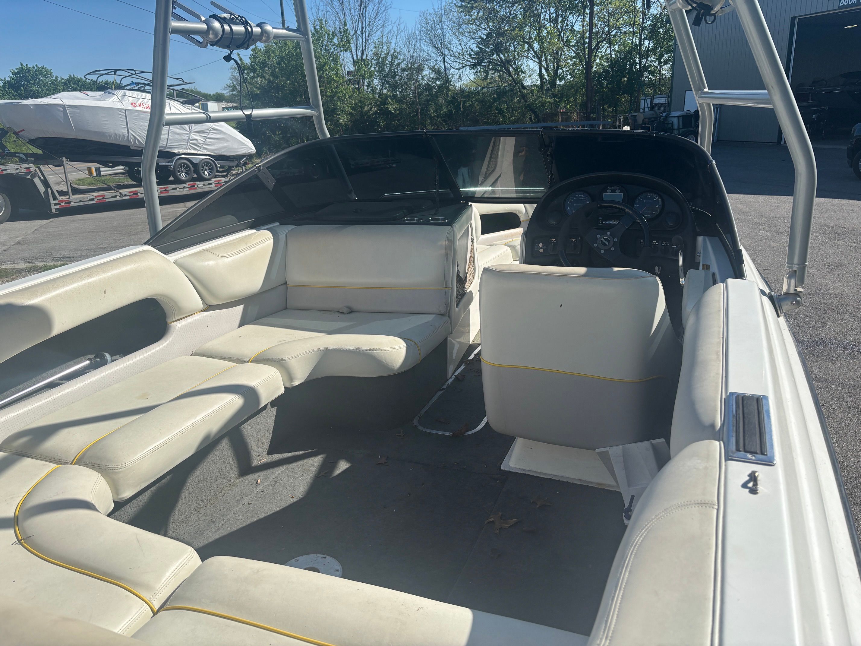 Interior of a 2000 Malibu Wakesetter VLX boat with white seating.