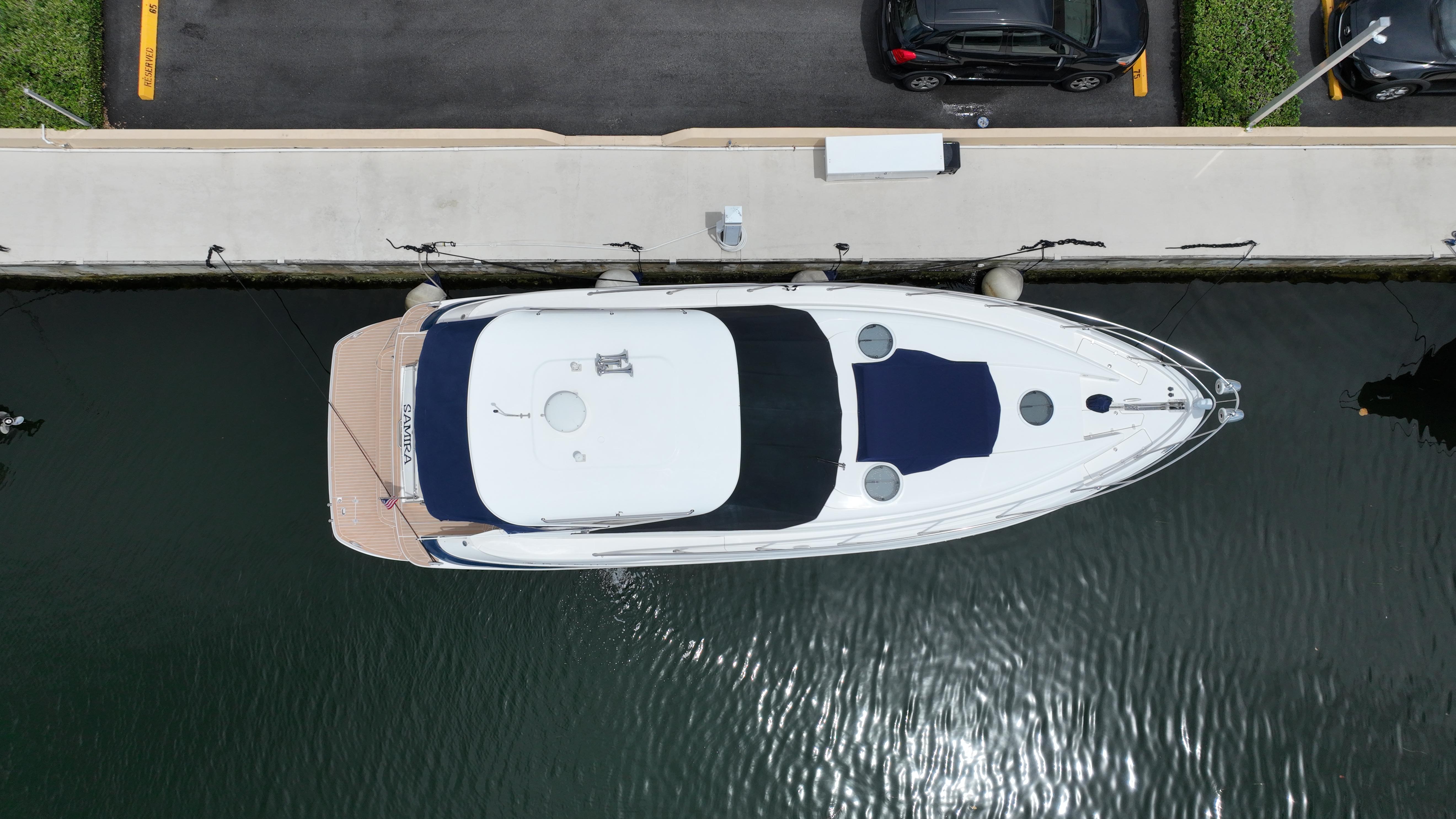 Aerial view of a 2007 Regal 4460 Commodore yacht docked at a marina.