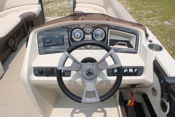 Steering console of a 2021 Tahoe LTZ Cruise boat with modern controls and gauges.